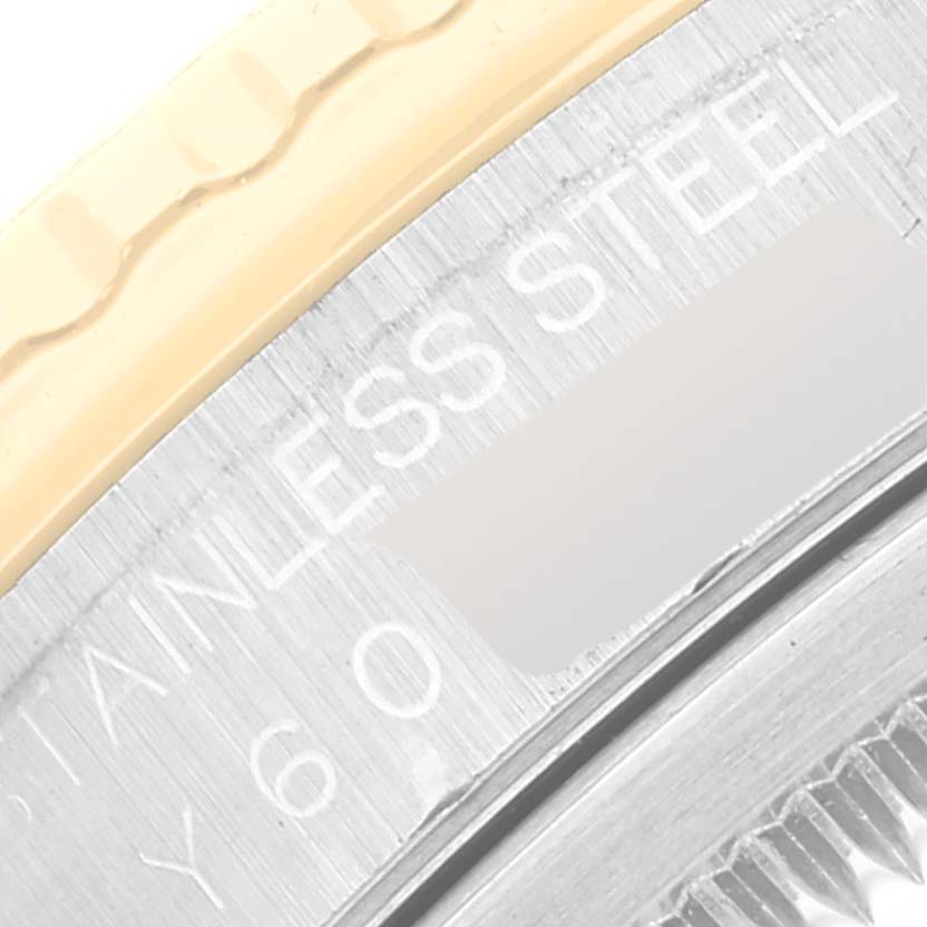 This is a close-up shot of the stainless steel and gold bezel of a Rolex Turn-o-Graph 16263 Men's Steel and Gold (two tone) Black Dial 16263 Men's Steel and Gold (two tone) Black Dial watch.