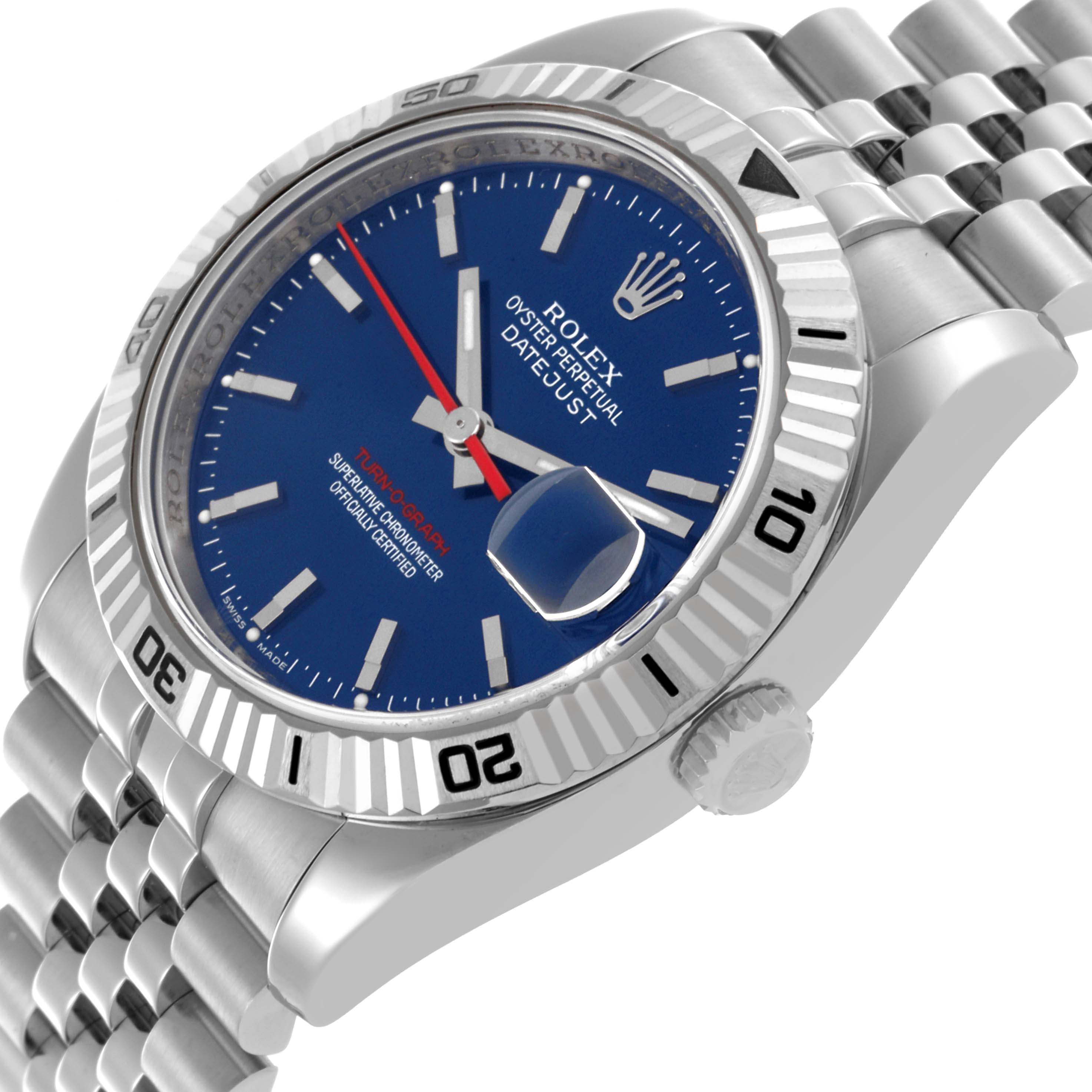 The Rolex Turn-o-Graph 116264 Men
s Stainless Steel Blue Dial 116264 Men
s Stainless Steel Blue Dial watch is shown at an angle highlighting the face, fluted bezel, crown, and part of the bracelet.