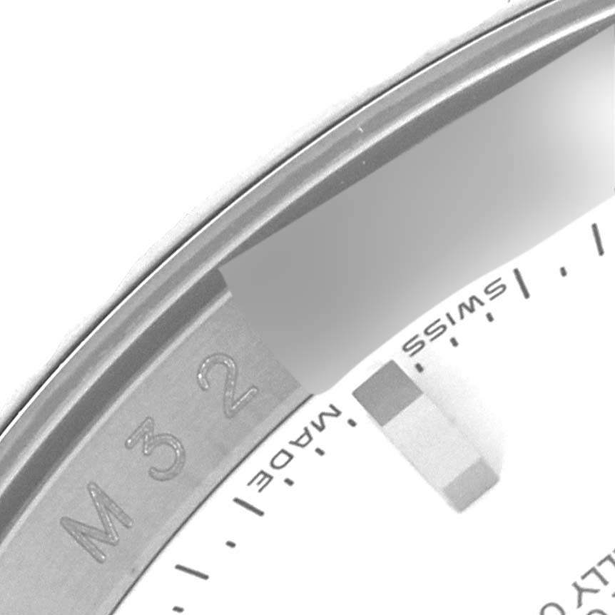 The image shows a close-up angle of the bezel and part of the dial of a Rolex Turn-o-Graph 116264 Men's Stainless Steel White Dial 116264 Men's Stainless Steel White Dial watch.