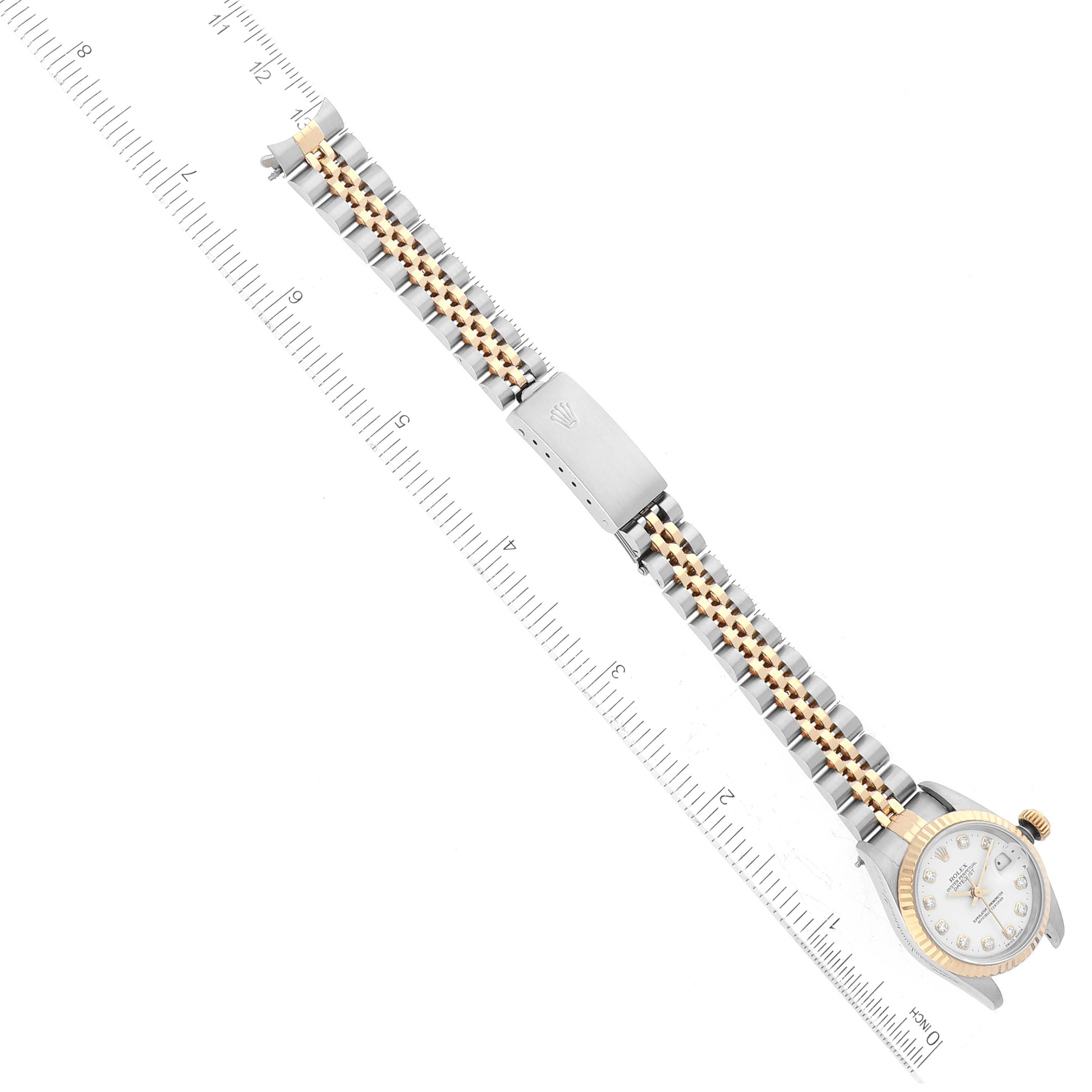 This image shows a top-down view of a Rolex Datejust 69173 Women's Steel and Gold (two tone) White Dial 69173 Women's Steel and Gold (two tone) White Dial watch including its dial, case, bracelet, and clasp.