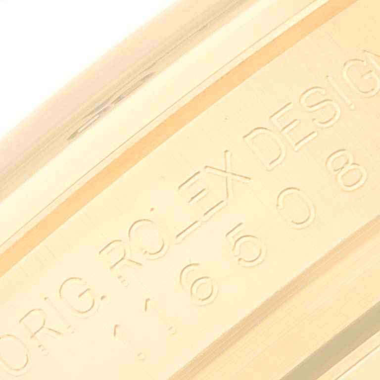 This image shows the side engraving of a Rolex Daytona 116508 Men's Yellow Gold Black Dial 116508 Men's Yellow Gold Black Dial watch, highlighting the "ORIG. ROLEX DESIGN" text.