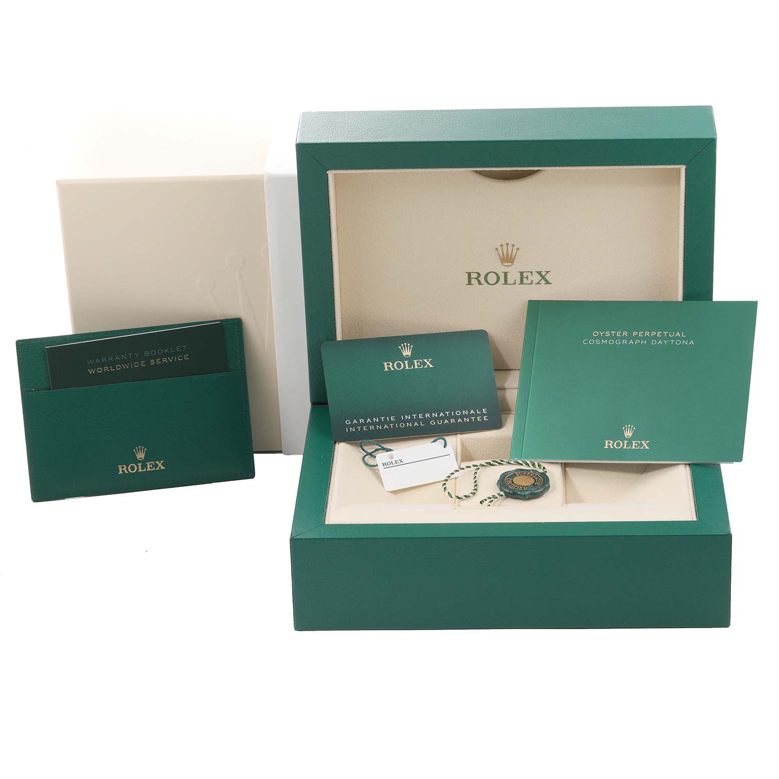 This image shows the packaging, warranty booklet, and accessories for a Rolex Daytona 116508 Men's Yellow Gold Black Dial 116508 Men's Yellow Gold Black Dial model watch.