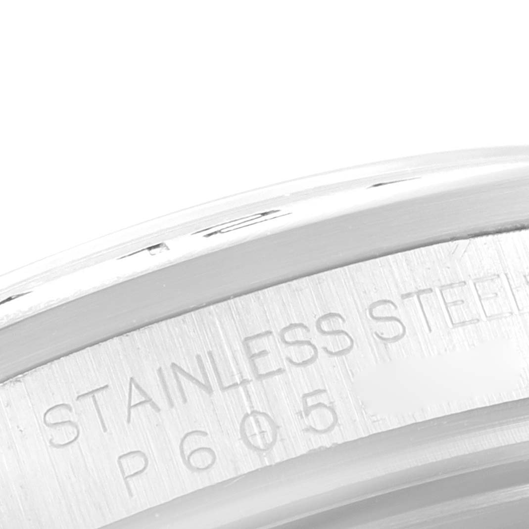 The image shows a close-up of the stainless steel case back of the Rolex Explorer 16570 Men's Stainless Steel White Dial 16570 Men's Stainless Steel White Dial watch, highlighting its engraved text.