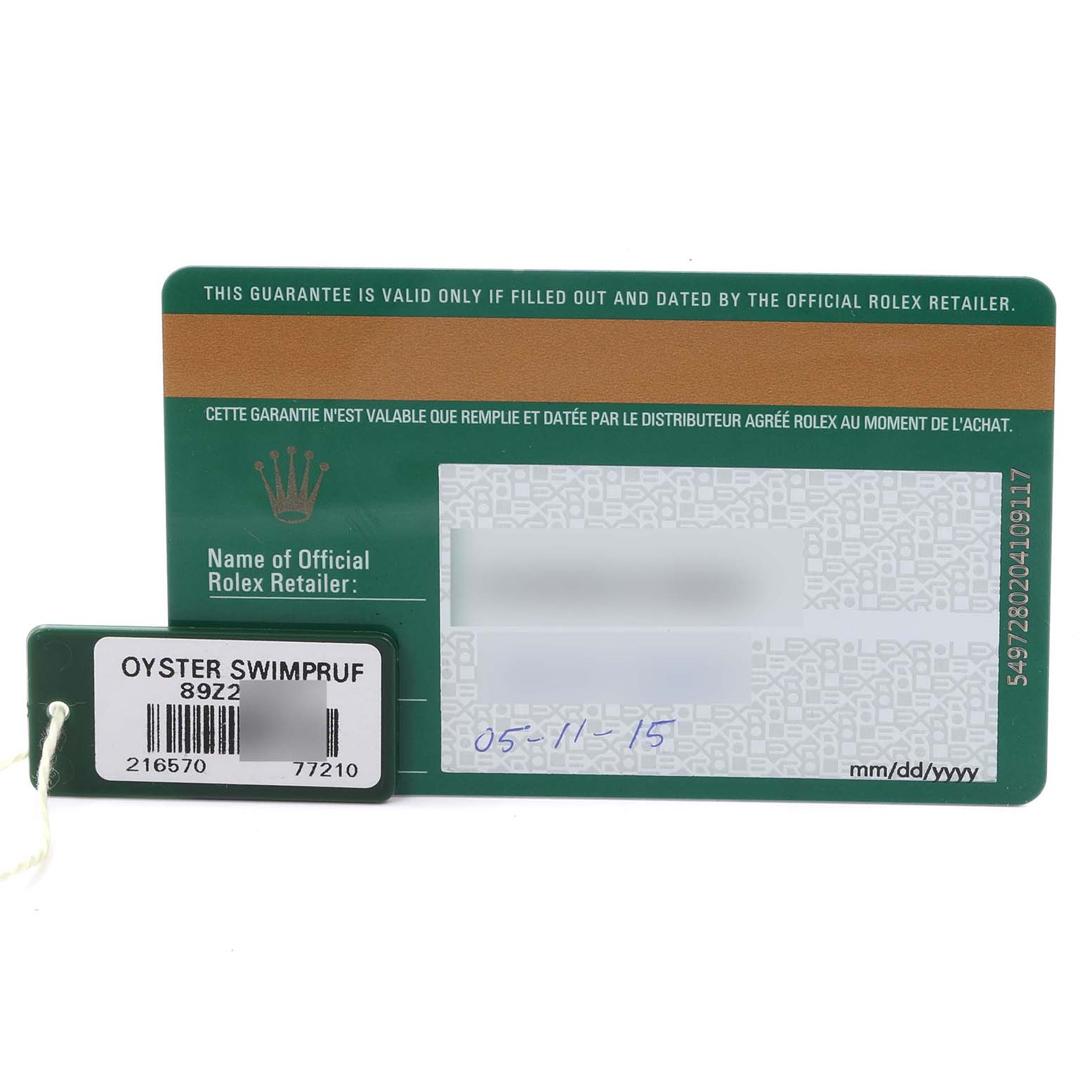 The image shows a Rolex Explorer 216570 Men's Stainless Steel Black Dial 216570 Men's Stainless Steel Black Dial warranty card and a green Oyster Swimpruf tag.