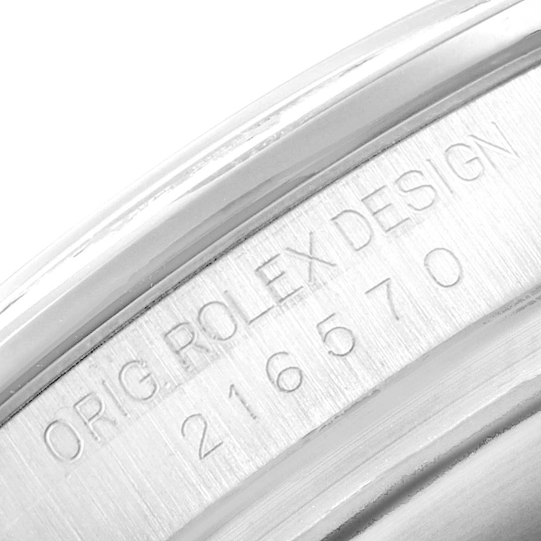 This image shows a close-up of the engraved serial number on the case of a Rolex Explorer 216570 Men's Stainless Steel White Dial 216570 Men's Stainless Steel White Dial watch.