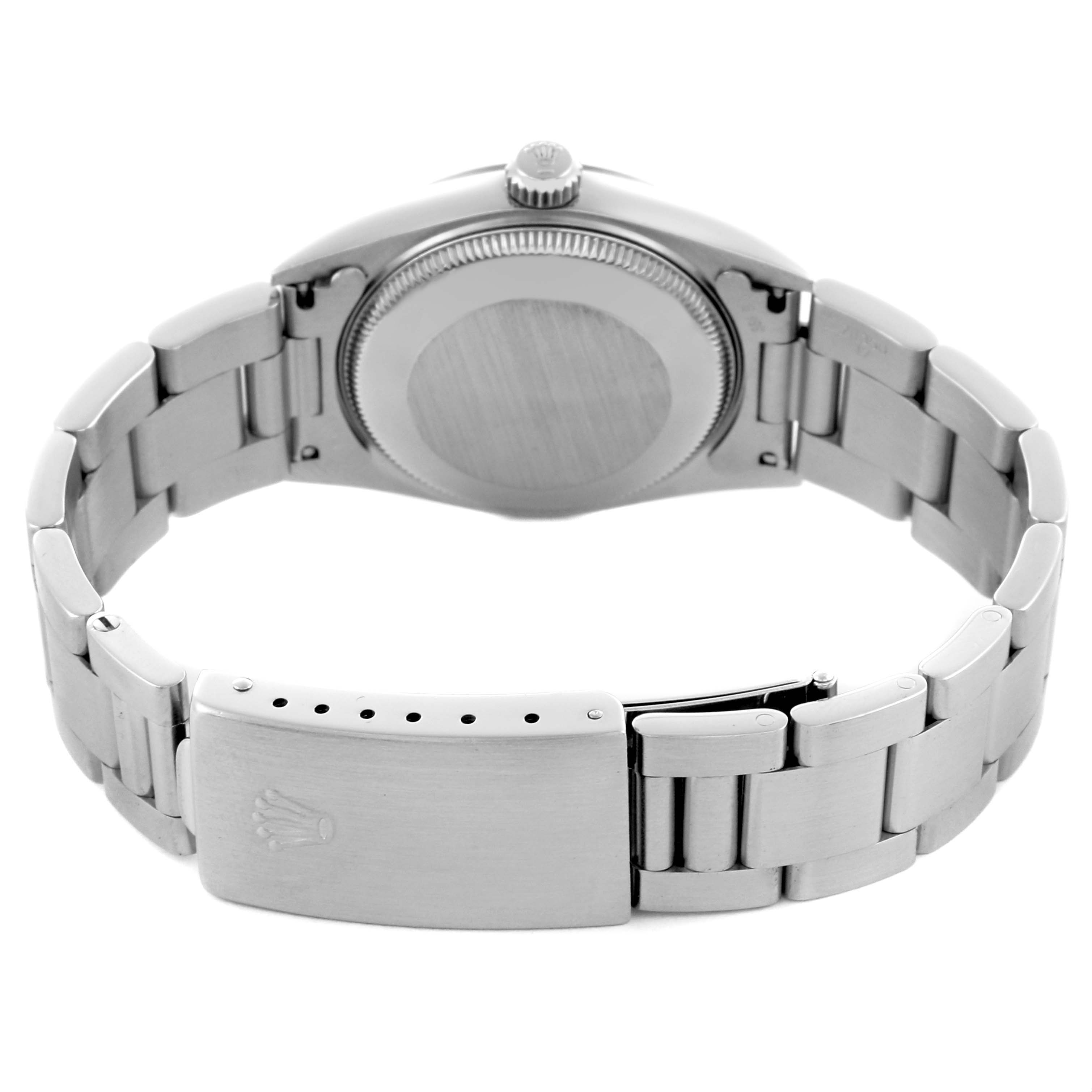 The image shows the back of a Rolex Mid-Size 67514 Women's Stainless Steel Silver Dial 67514 Women's Stainless Steel Silver Dial watch, highlighting the case, crown, and bracelet clasp.