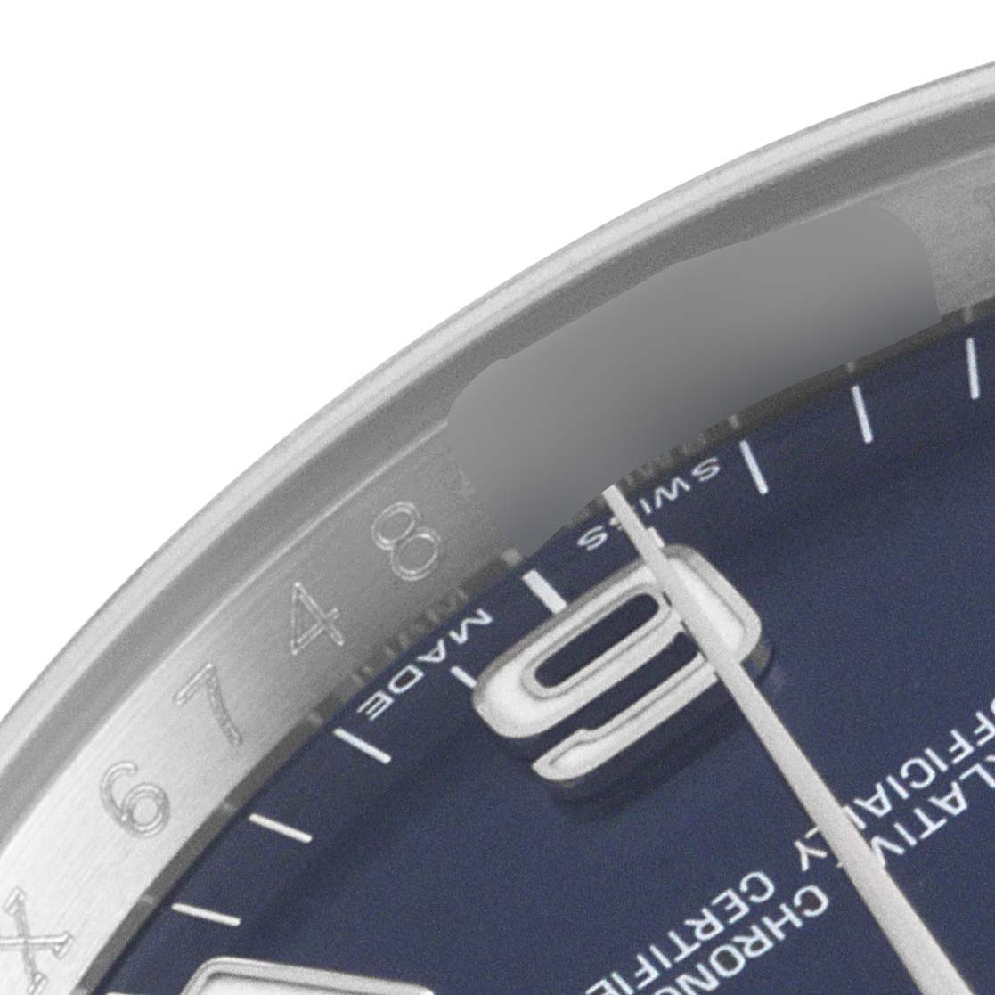 This image shows a close-up of the dial, bezel, and part of the minute hand of an Air-King model by Rolex.