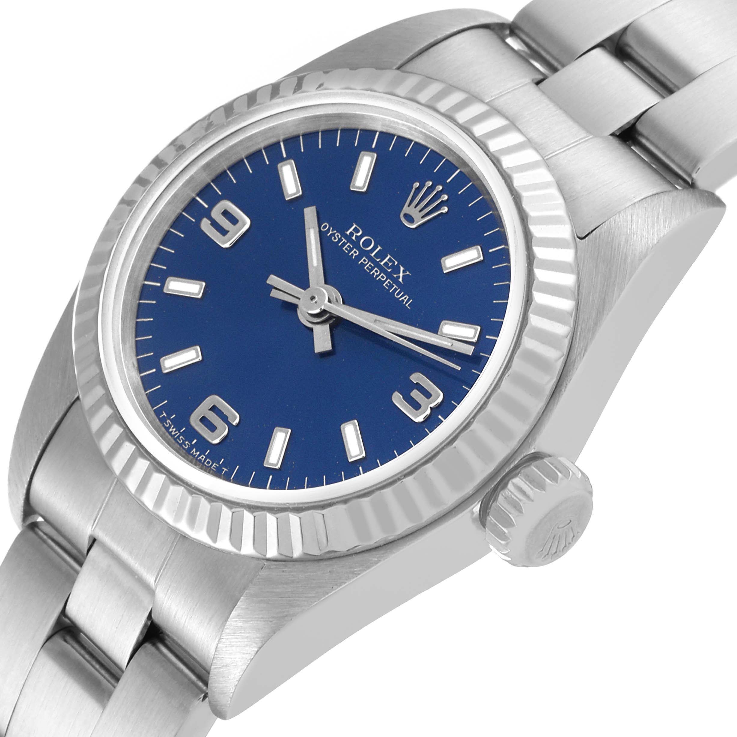 The image shows a close-up angled view of the Rolex Oyster Perpetual 67194 Women
s Stainless Steel Blue Dial 67194 Women
s Stainless Steel Blue Dial watch, highlighting the blue dial, bezel, and bracelet.