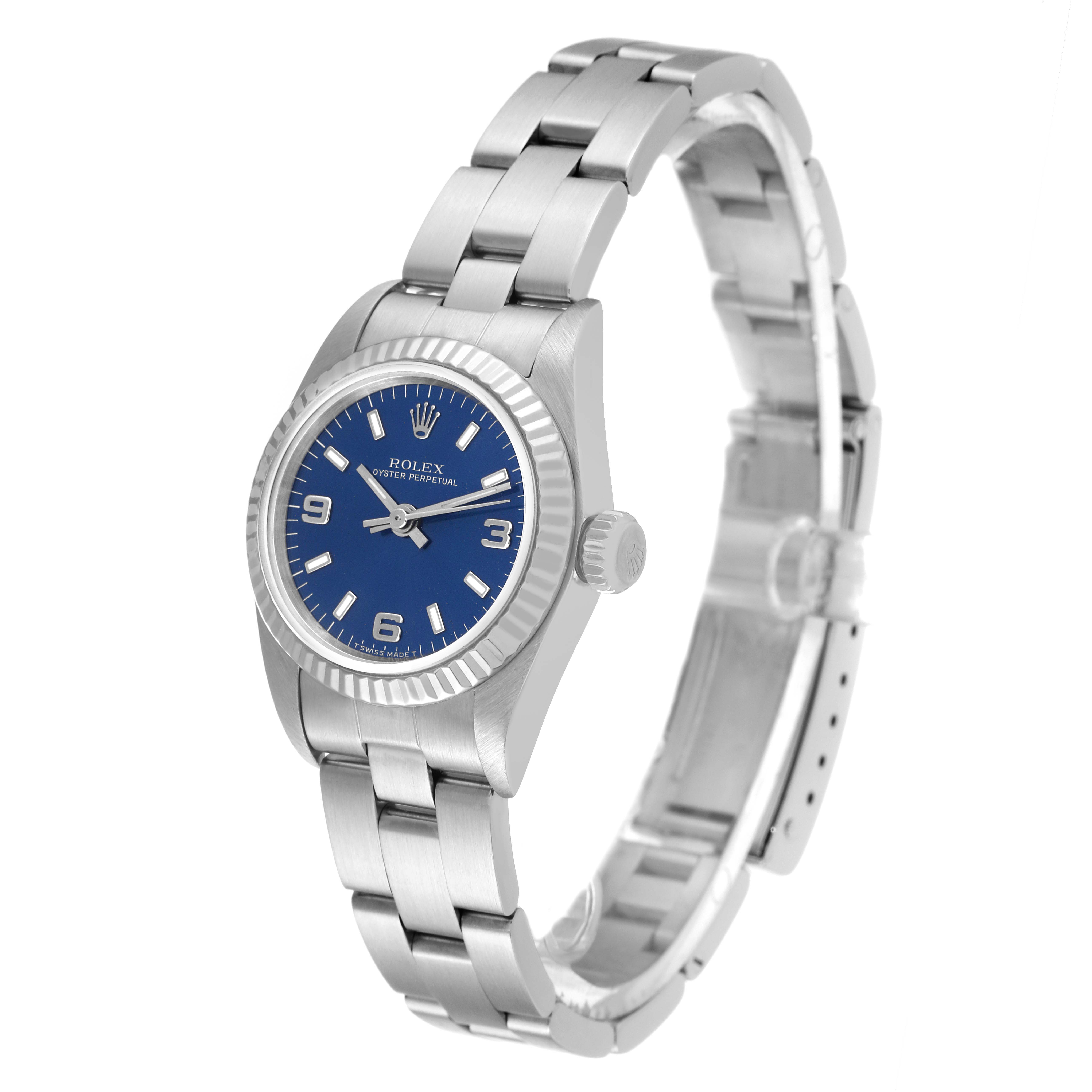 The Rolex Oyster Perpetual 67194 Women
s Stainless Steel Blue Dial 67194 Women
s Stainless Steel Blue Dial watch is shown at a slight angle, displaying its face, bezel, crown, and bracelet.