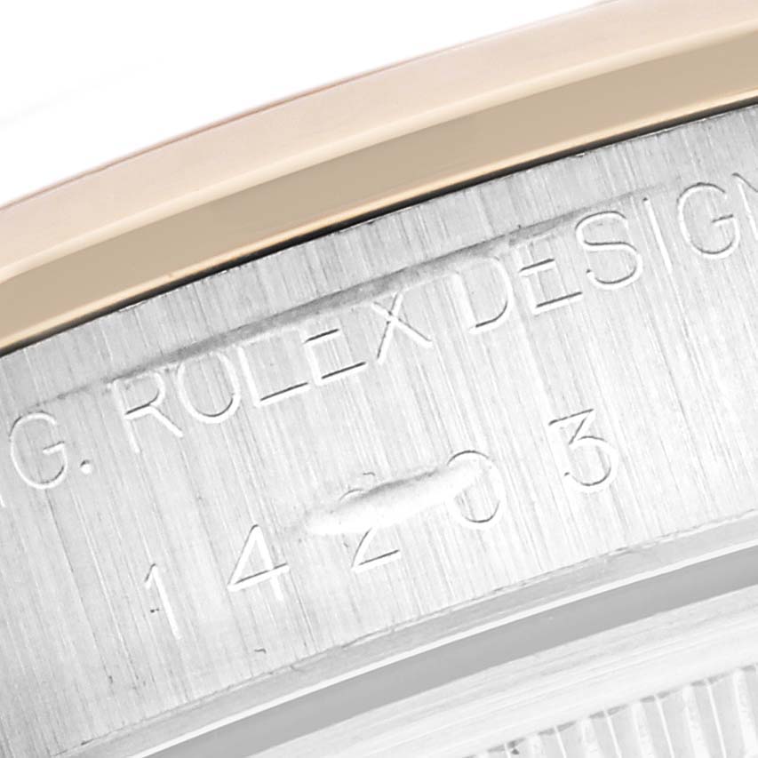 The image shows a close-up of the edge and engraved design number on a Rolex Oyster Perpetual 14203 Men's Steel and Gold (two tone) Grey Dial 14203 Men's Steel and Gold (two tone) Grey Dial watch case.