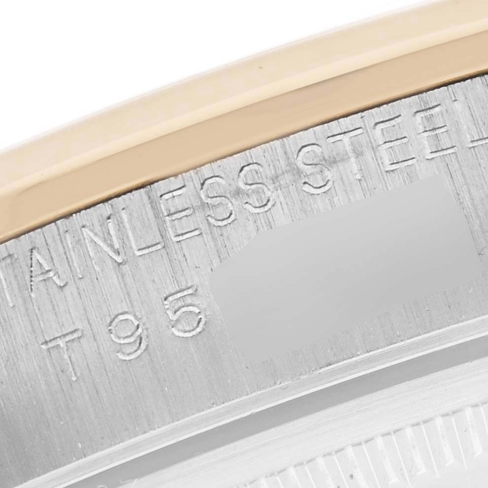 The image shows a close-up of the bezel and engraved text on a Rolex Oyster Perpetual 14203 Men's Steel and Gold (two tone) Grey Dial 14203 Men's Steel and Gold (two tone) Grey Dial watch.