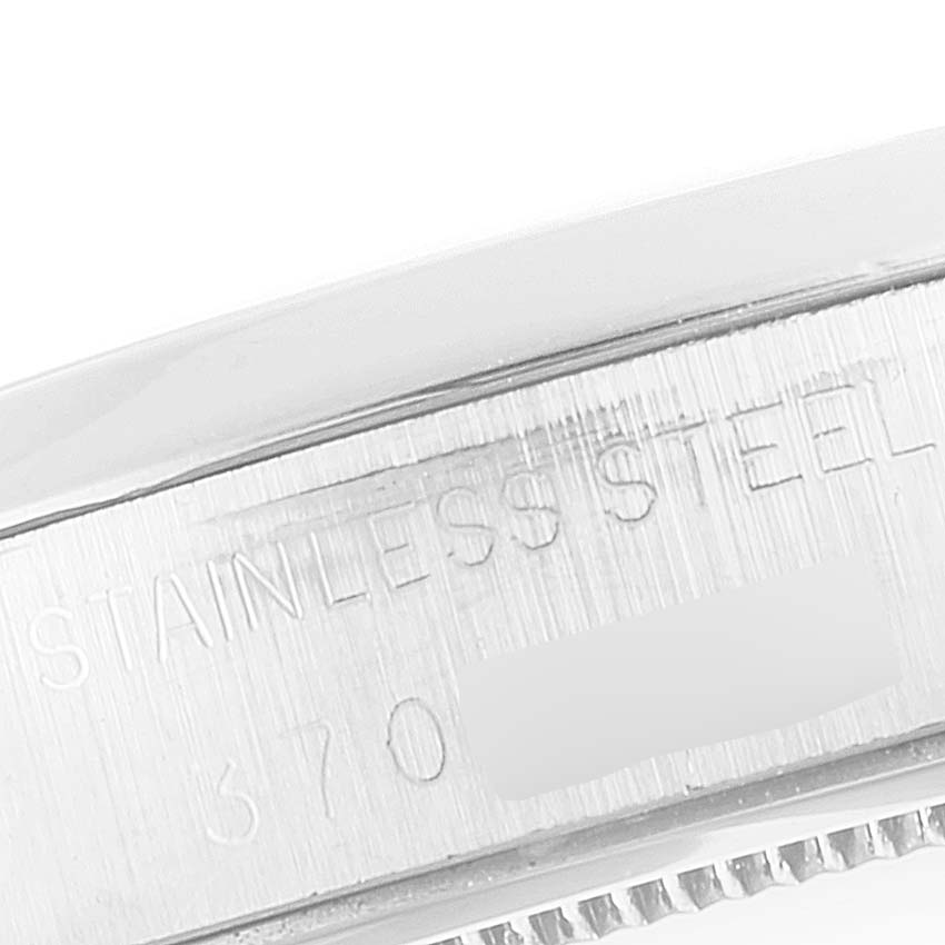 The image shows a close-up of the outer case side of the Vintage Collection model by Rolex, indicating "STAINLESS STEEL".