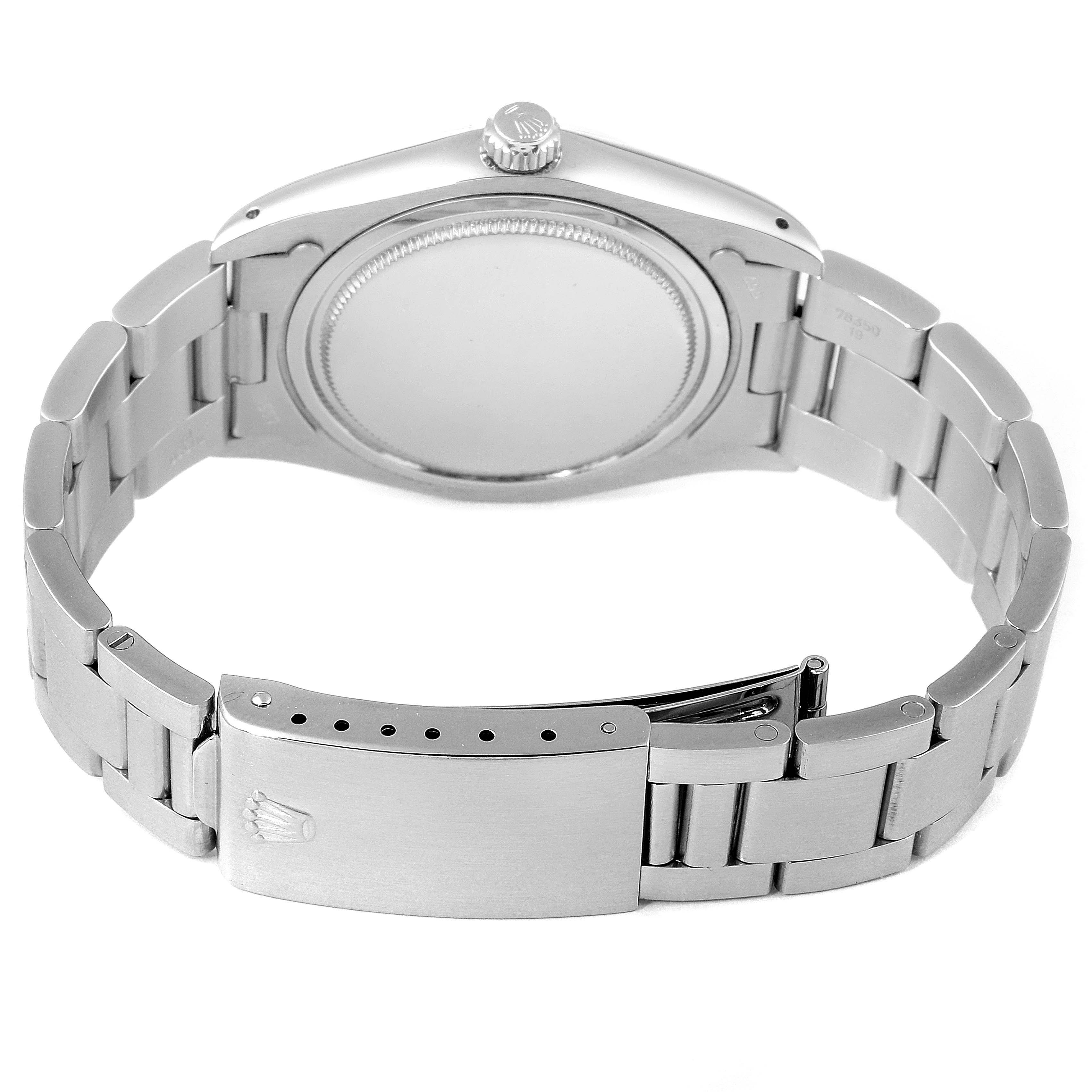 This image shows the back of a Vintage Collection model by Rolex, highlighting the case back, crown, and bracelet with clasp.