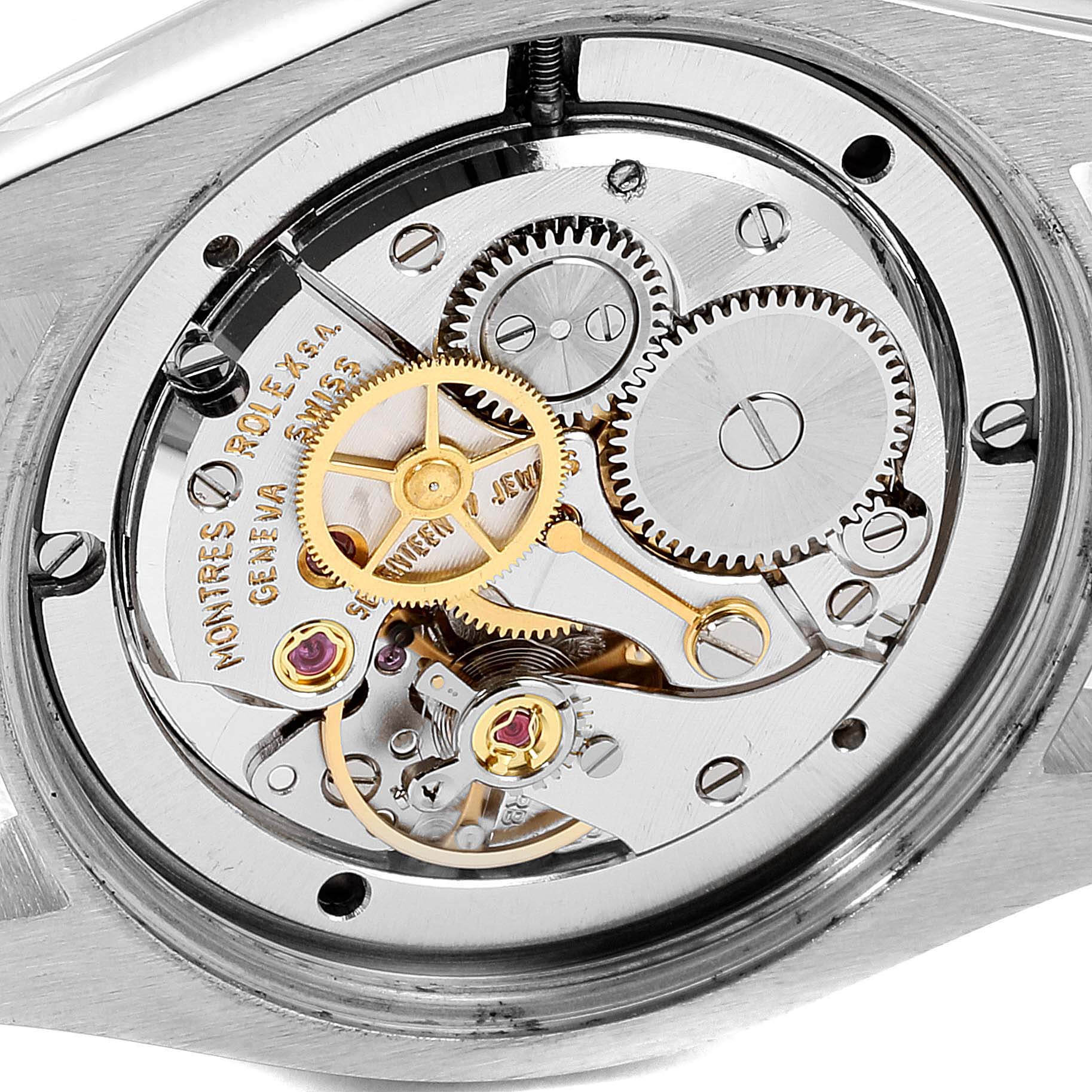 This image shows the intricate movement of a Vintage Collection model by Rolex from a close-up angle, focusing on the gears and mechanism.