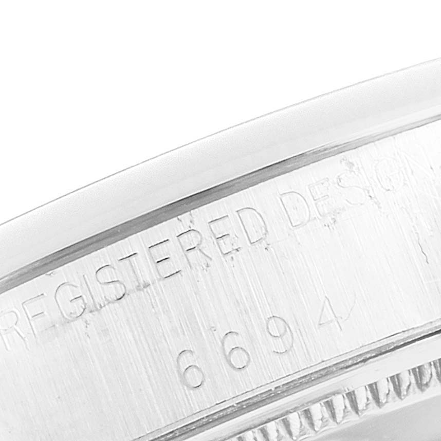 This close-up image shows the side of the bezel with the reference number "6694" engraved on the Rolex Vintage Collection 6694 Men's Stainless Steel Silver Dial 6694 Men's Stainless Steel Silver Dial model.