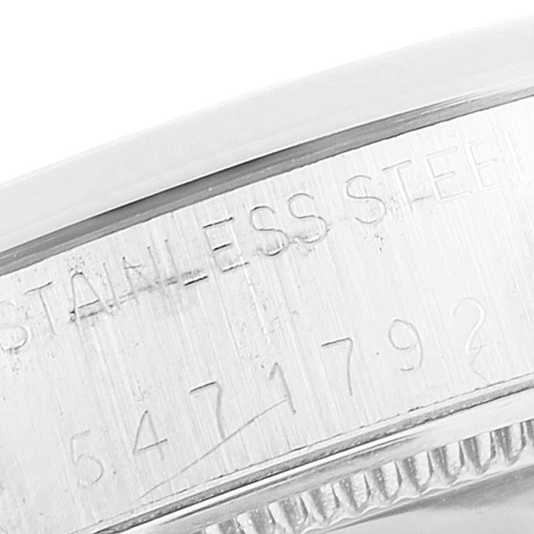 The image shows a close-up of the stainless steel casing with engravings on a Rolex Vintage Collection 6694 Men's Stainless Steel Silver Dial 6694 Men's Stainless Steel Silver Dial model watch.