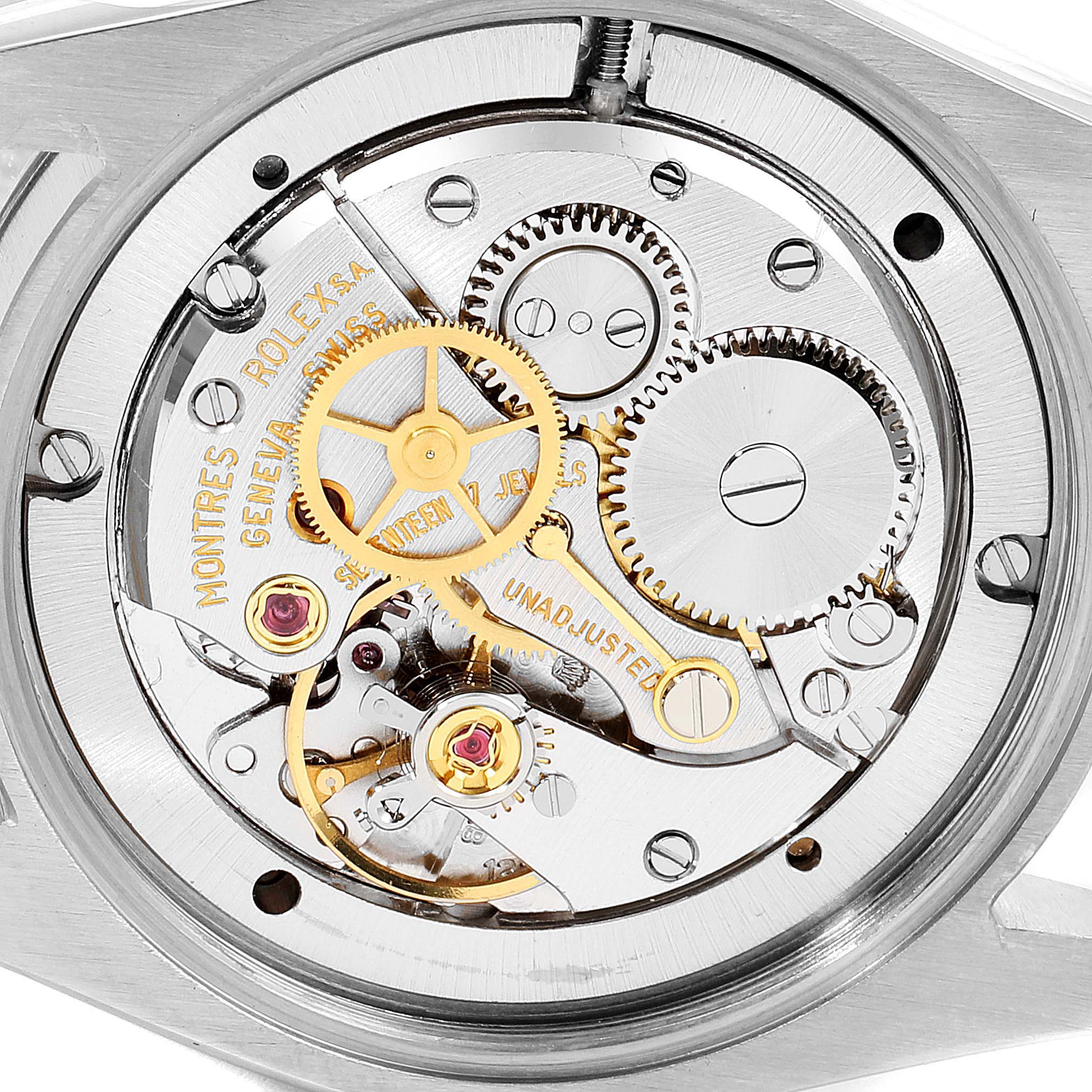 The image shows the movement mechanism of a Rolex Vintage Collection 6694 Men's Stainless Steel Silver Dial 6694 Men's Stainless Steel Silver Dial watch, focusing on the intricate gears and internal components.