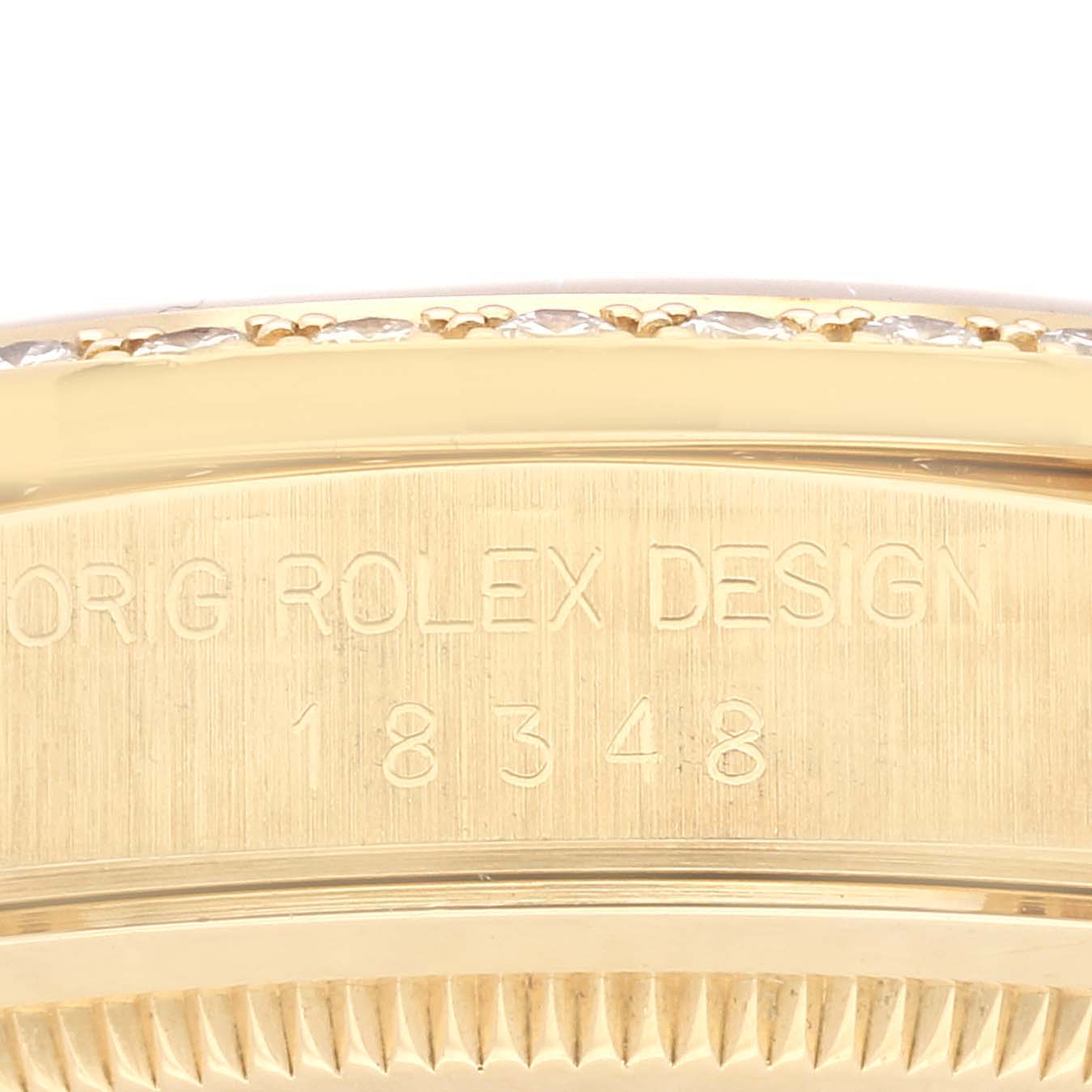 This image shows a close-up of the engraved side of a Rolex President 18348 Men
s Yellow Gold Champagne Dial 18348 Men
s Yellow Gold Champagne Dial model watch.