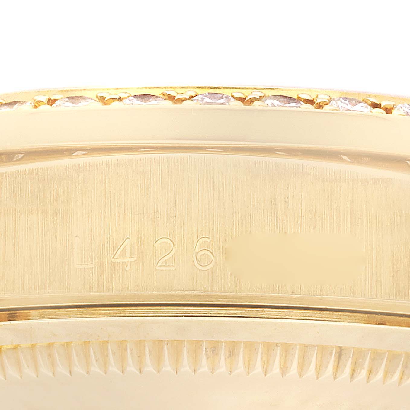 This close-up image shows the side profile of the bezel and part of the case of a Rolex President 18348 Men
s Yellow Gold Champagne Dial 18348 Men
s Yellow Gold Champagne Dial model watch.
