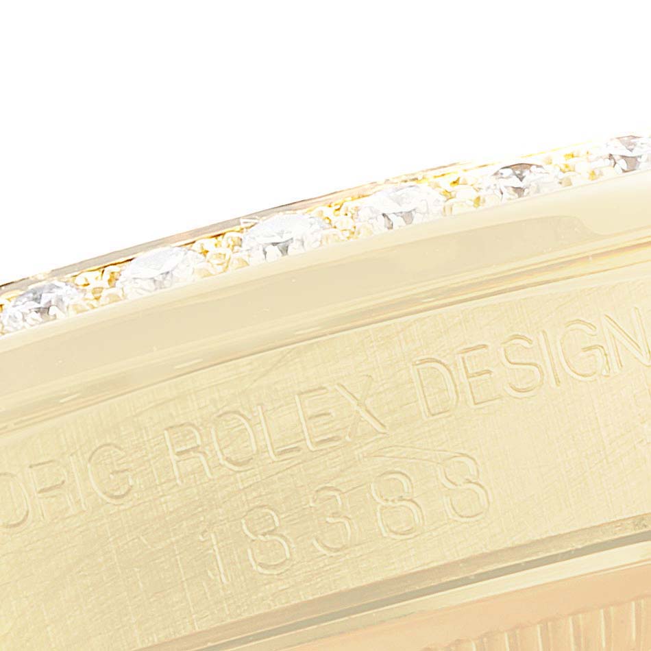 This close-up image shows the side of the bezel and the engraved text on the case of a Rolex President 18388 Men's Yellow Gold Champagne Dial 18388 Men's Yellow Gold Champagne Dial model watch.