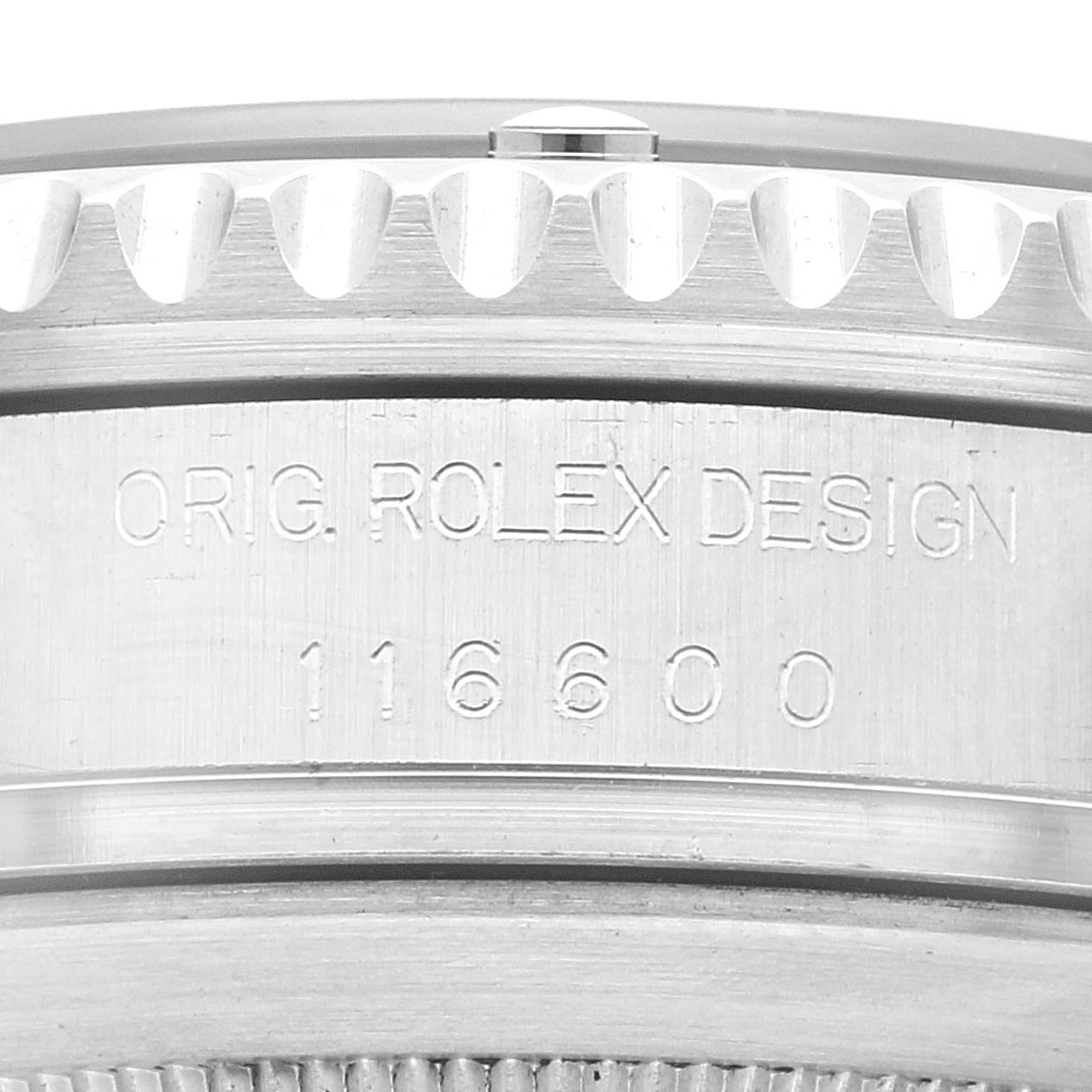 This close-up image shows the engraved side of the bezel and case of a Rolex Sea-Dweller 116600 Men
s Stainless Steel Black Dial 116600 Men
s Stainless Steel Black Dial watch, model 116600.