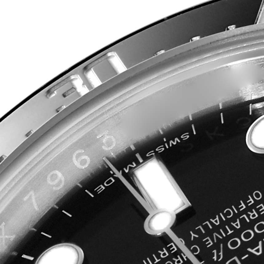 This image shows a close-up of the dial and bezel of a Rolex Sea-Dweller 116600 Men
s Stainless Steel Black Dial 116600 Men
s Stainless Steel Black Dial watch, focusing on the hour markers and part of the branding.