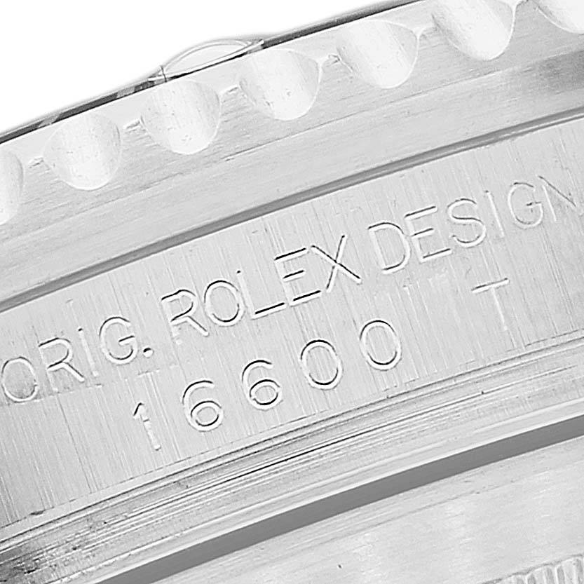 The image shows a close-up of the case back of a Rolex Sea-Dweller 16600T Men
s Stainless Steel Black Dial 16600T Men
s Stainless Steel Black Dial watch with the model number 16600 etched onto it.