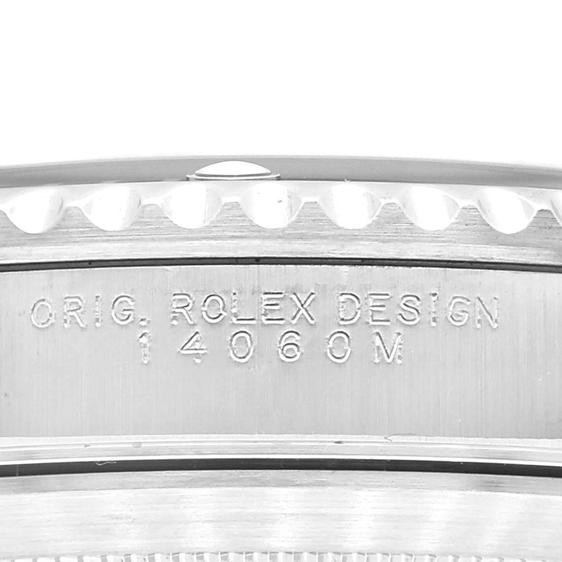 The image shows a close-up of the side of the case back on a Rolex Submariner 14060M Men's Stainless Steel Black Dial 14060M Men's Stainless Steel Black Dial, displaying the model number 14060M.