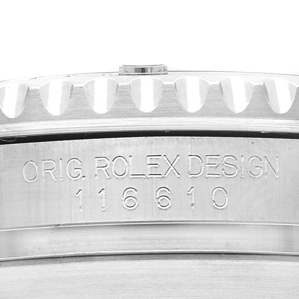 This image shows a close-up of the side of a Rolex Submariner 116610 Men's Stainless Steel Black Dial 116610 Men's Stainless Steel Black Dial watch, highlighting the engraved model number and bezel edge.