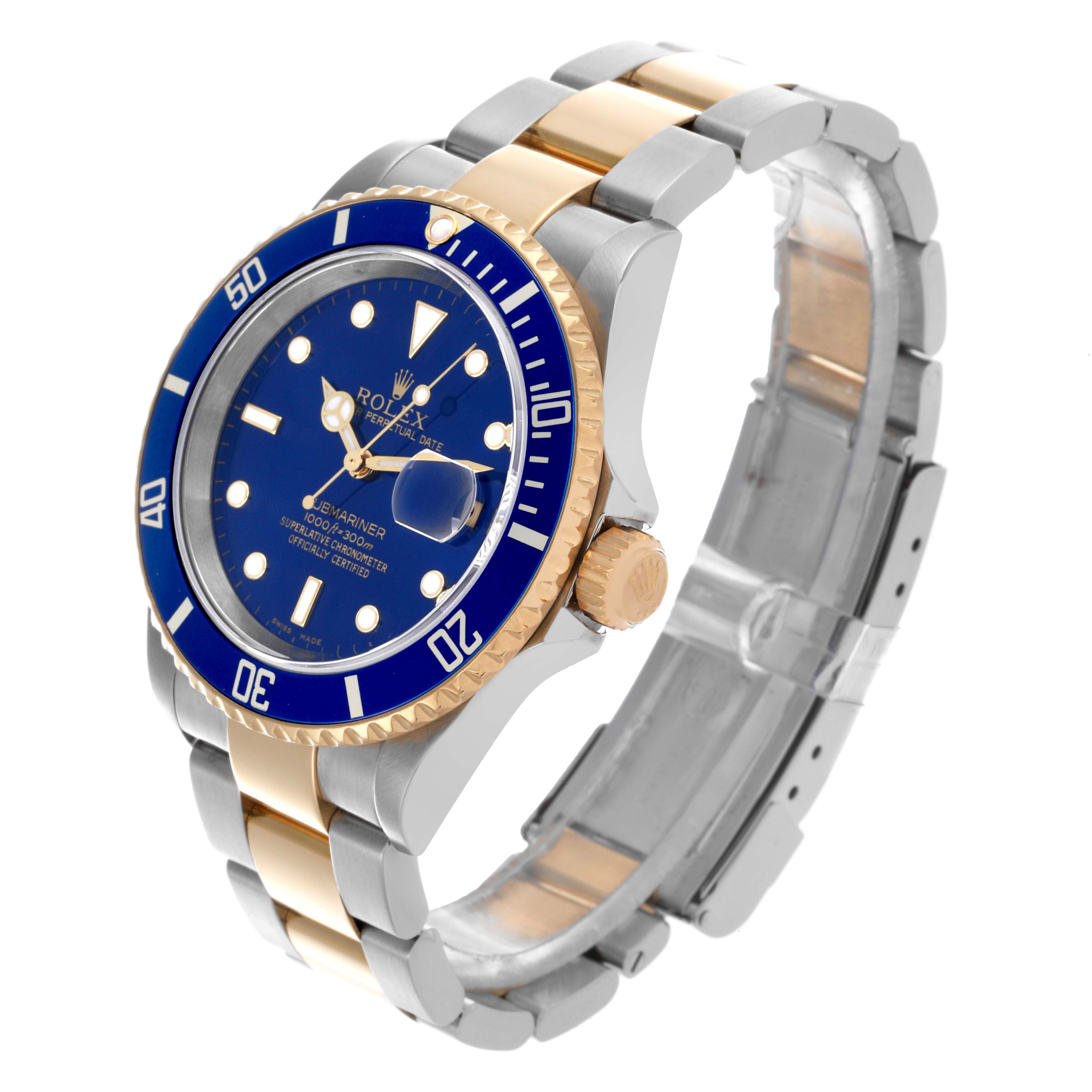 The Rolex Submariner 16613 Men's Steel and Gold (two tone) Blue Dial 16613 Men's Steel and Gold (two tone) Blue Dial is angled to show the face, bezel, case, crown, and bracelet in two-tone metal.