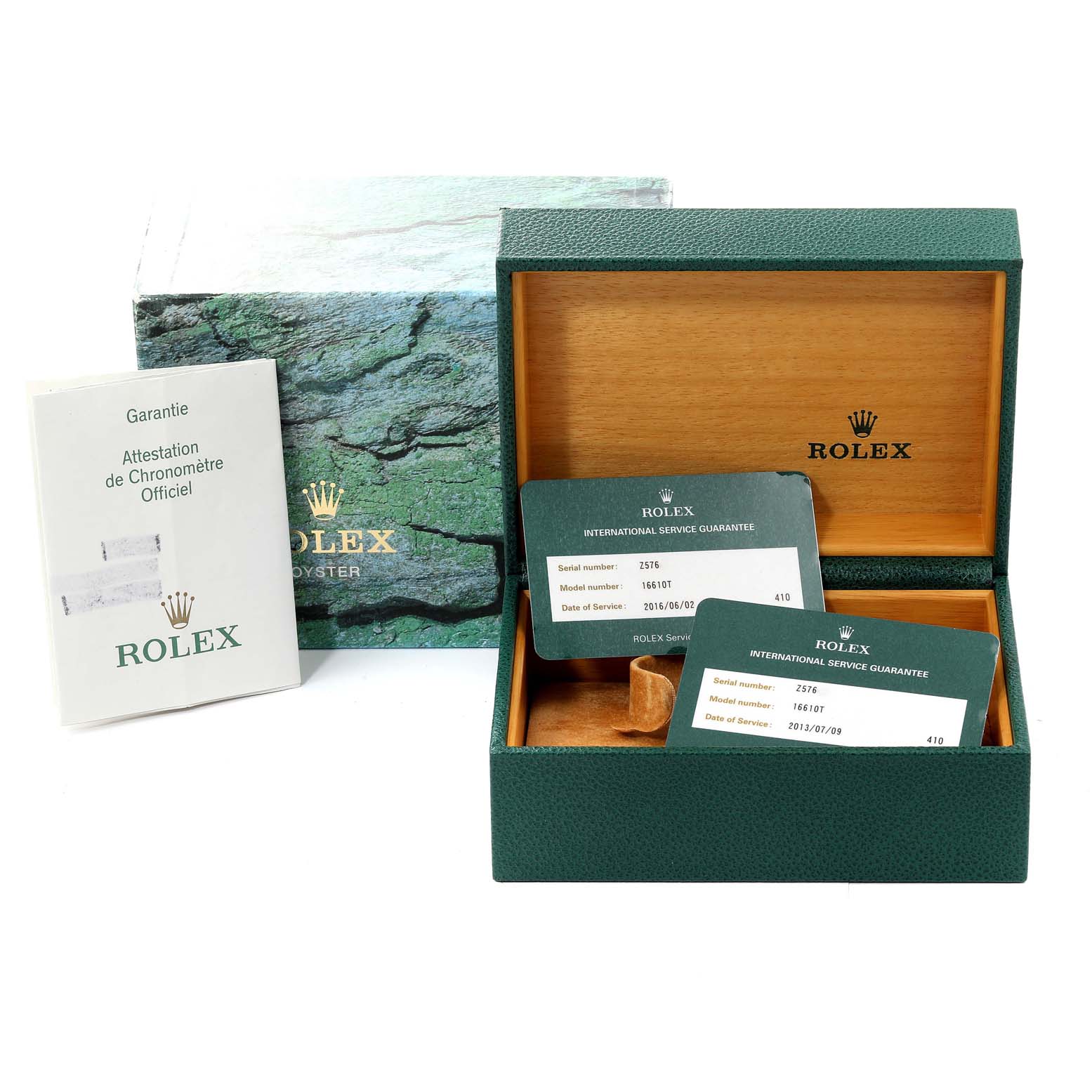 The image shows a Rolex Submariner 16610 Men
s Stainless Steel Black Dial 16610 Men
s Stainless Steel Black Dial packaging, including the box, guarantee booklet, and service guarantee cards.