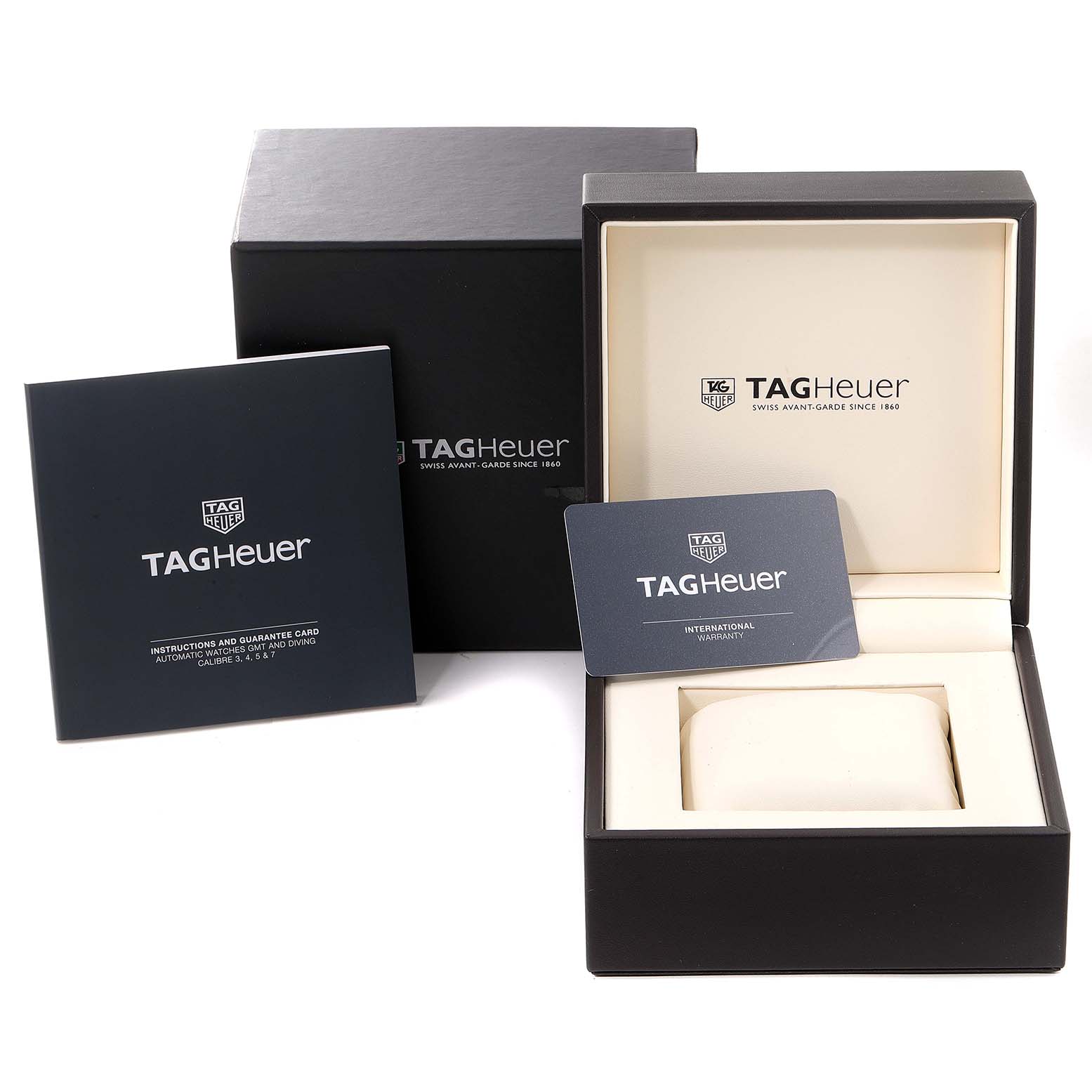 The image shows the Tag Heuer Aquaracer WAY201A.BA0927 Men's Stainless Steel Black Dial WAY201A.BA0927 Men's Stainless Steel Black Dial watch box, warranty card, and instruction booklet from an angle that captures a front view.