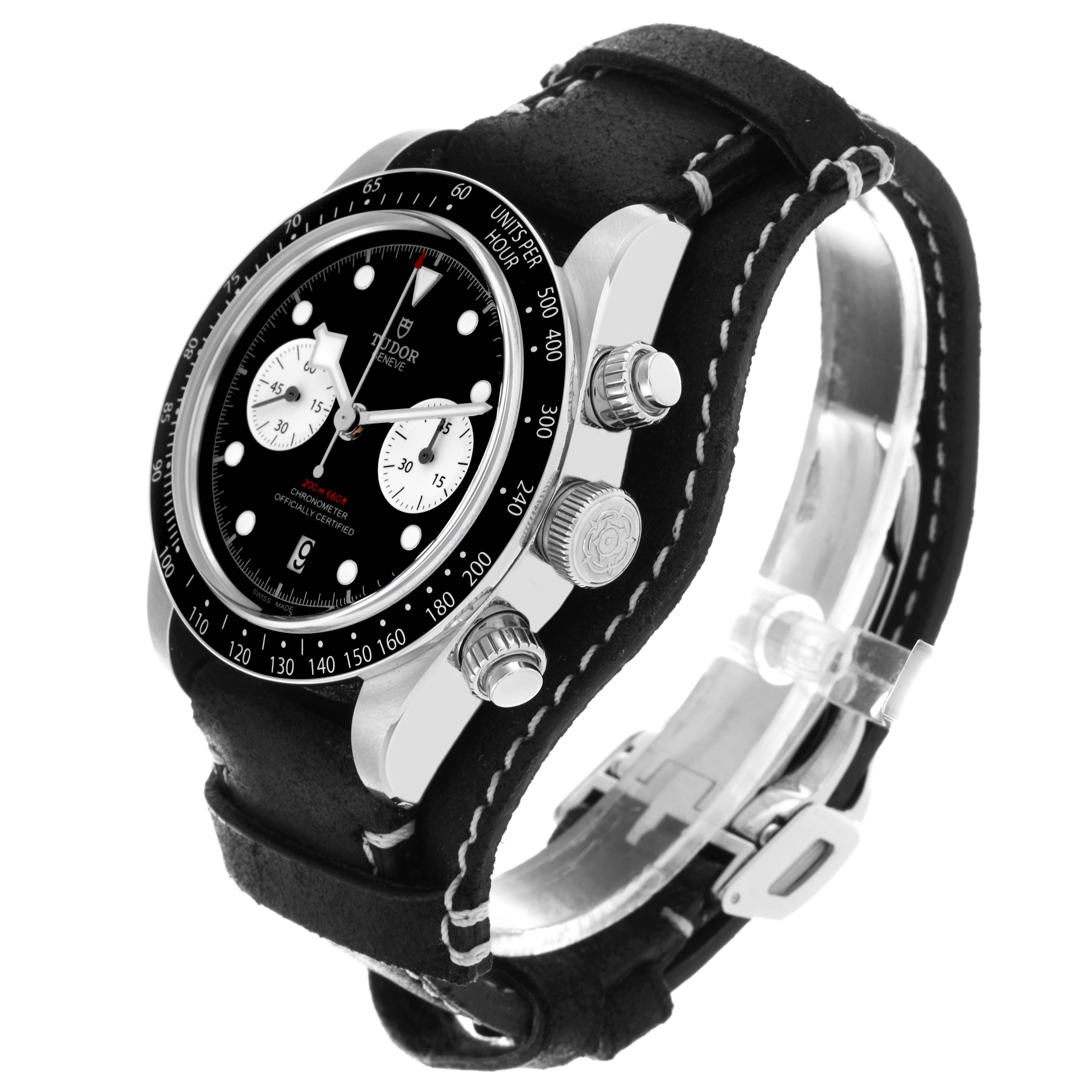 The Tudor Heritage Chrono 79360N Men's Stainless Steel Black Dial 79360N Men's Stainless Steel Black Dial watch is shown from a side angle, highlighting the bezel, crown, pushers, and black leather strap.