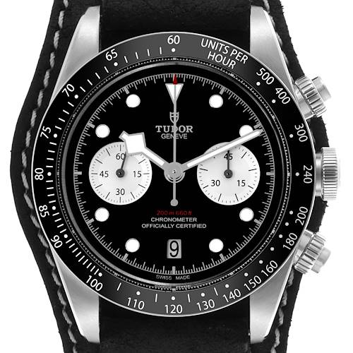 The Tudor Heritage Chrono watch is shown from a front angle, highlighting the dial, bezel, and pushers.