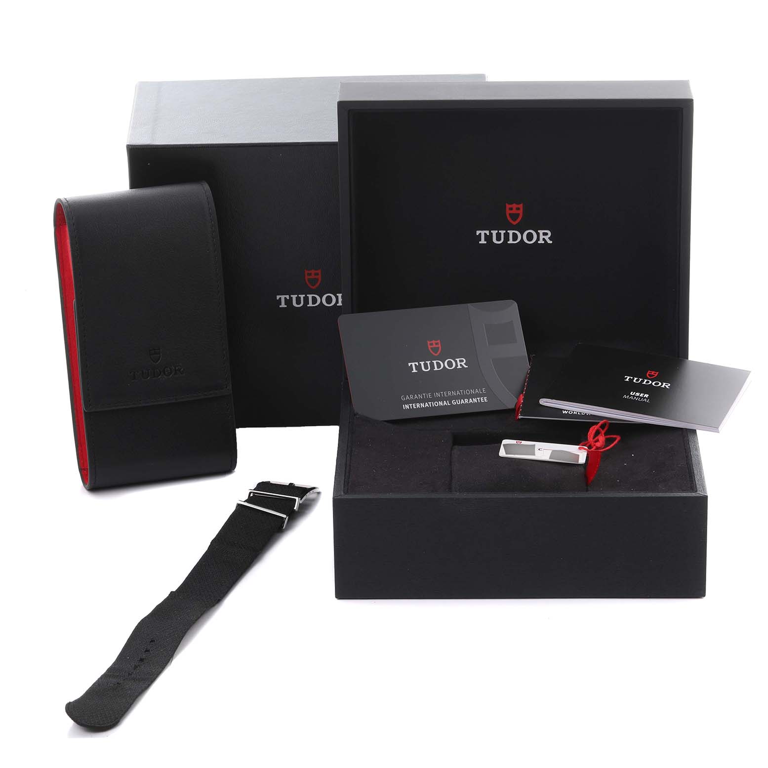 The image shows the Tudor Heritage Chrono 79360N Men's Stainless Steel Black Dial 79360N Men's Stainless Steel Black Dial packaging, including a box, manual, warranty card, and strap.