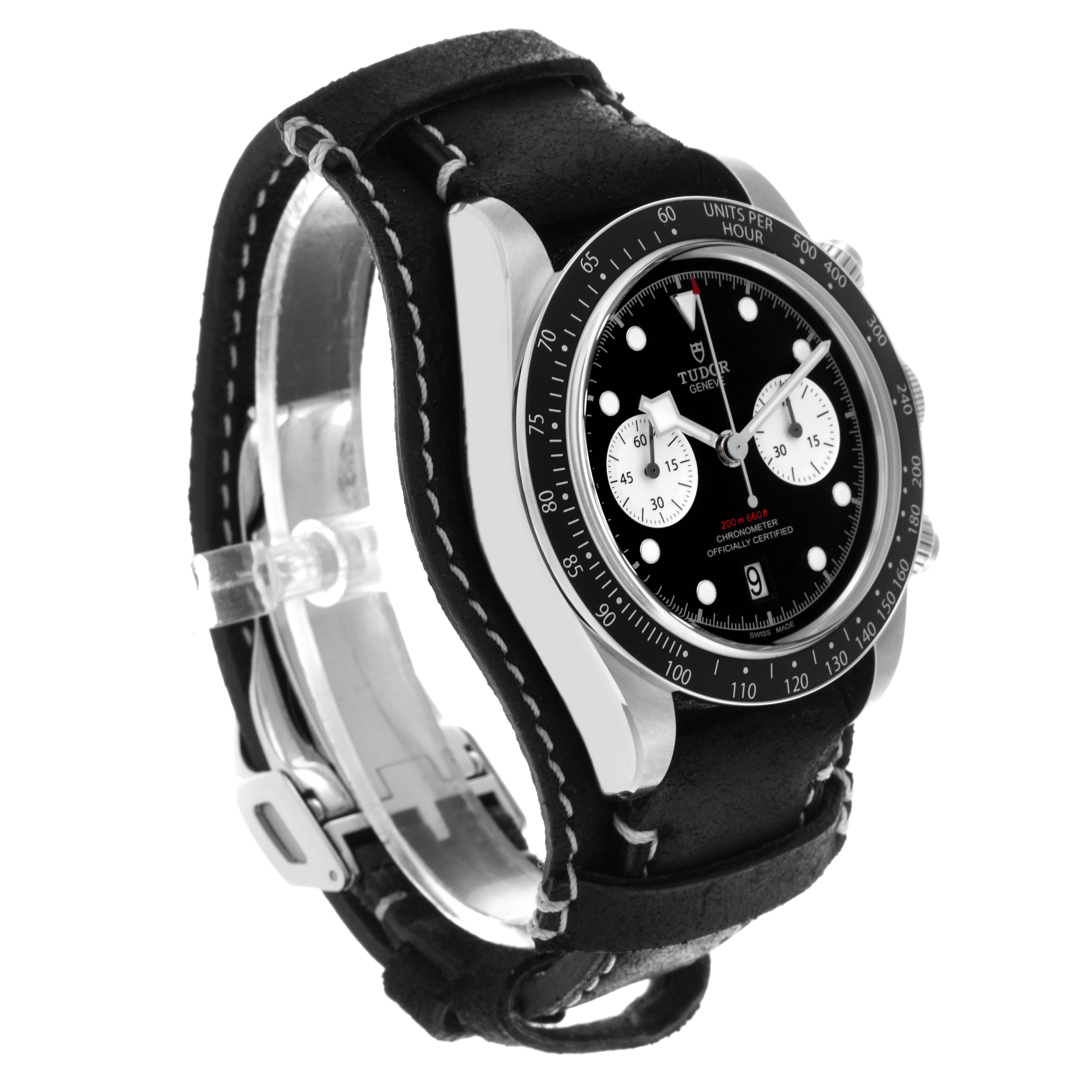 The Tudor Heritage Chrono 79360N Men's Stainless Steel Black Dial 79360N Men's Stainless Steel Black Dial watch is shown at an angled side view, displaying its case, dial, bezel, strap, and buckle.