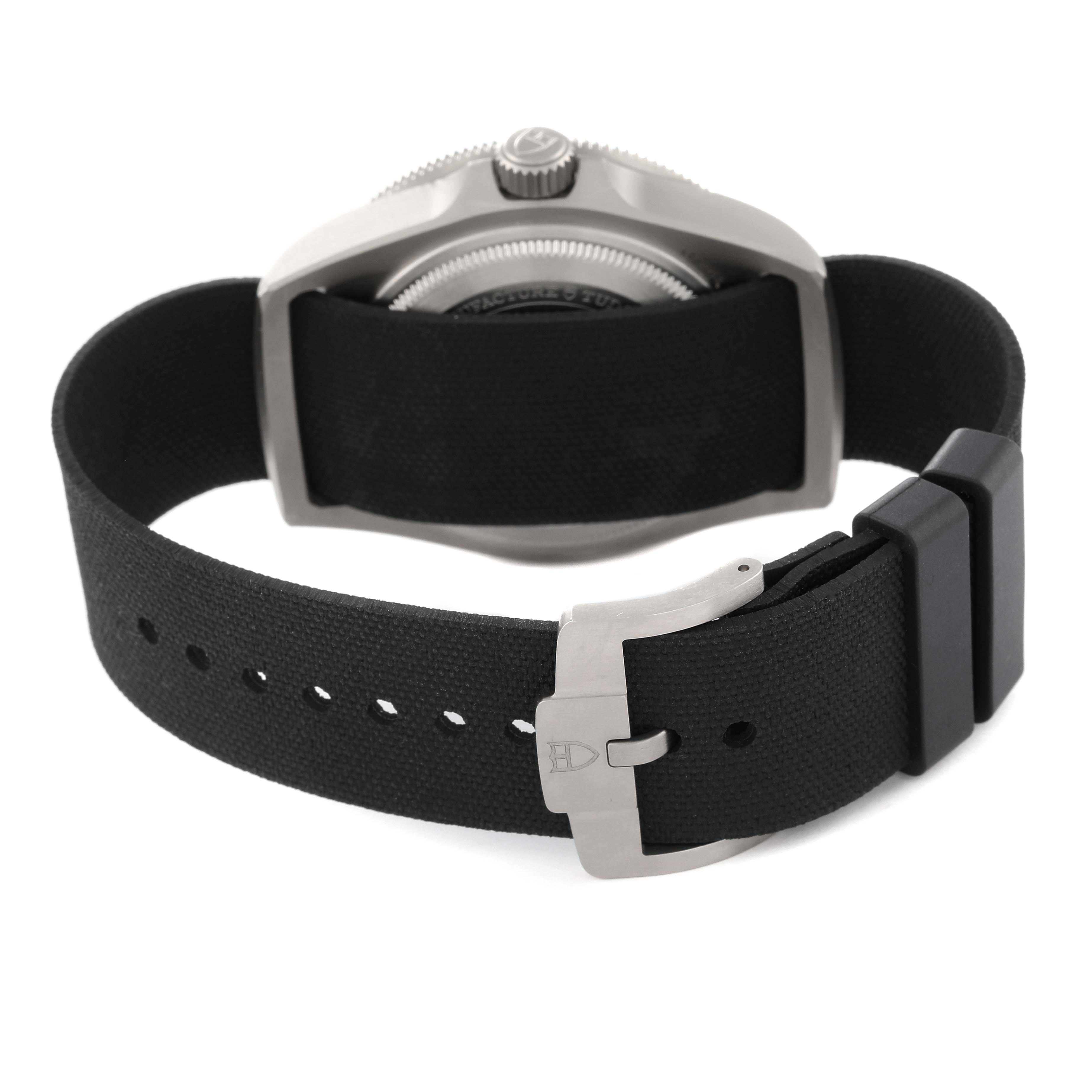 The image shows the back view of the Tudor Pelagos M25717N-0001 Men
s Titanium Black Dial M25717N-0001 Men
s Titanium Black Dial watch, focusing on the case back, strap, and buckle.