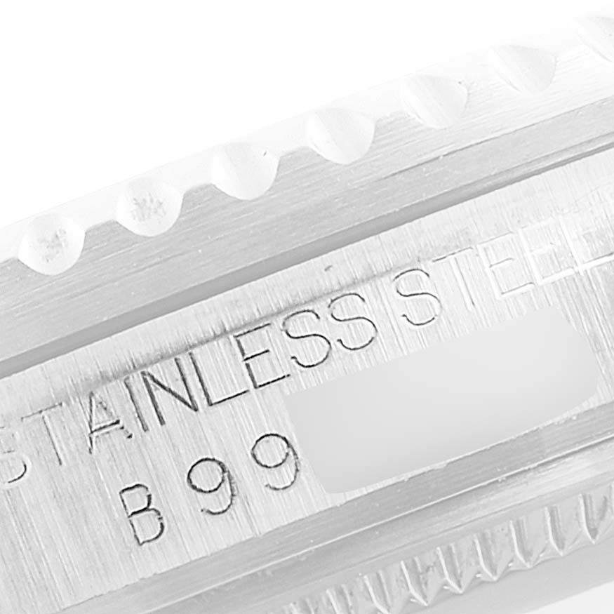 This close-up image shows the edge of the bezel and part of the case back of the Tudor Prince watch, highlighting the "Stainless Steel" engraving.