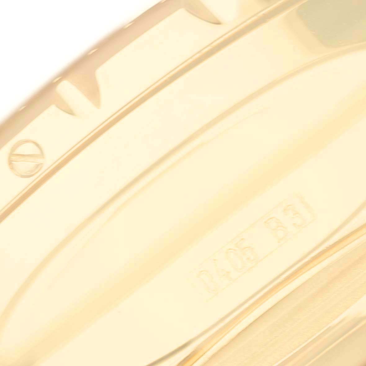 This close-up image shows part of the bezel and case back of a Breitling Bentley K25362 Men's Yellow Gold Black Dial K25362 Men's Yellow Gold Black Dial watch.