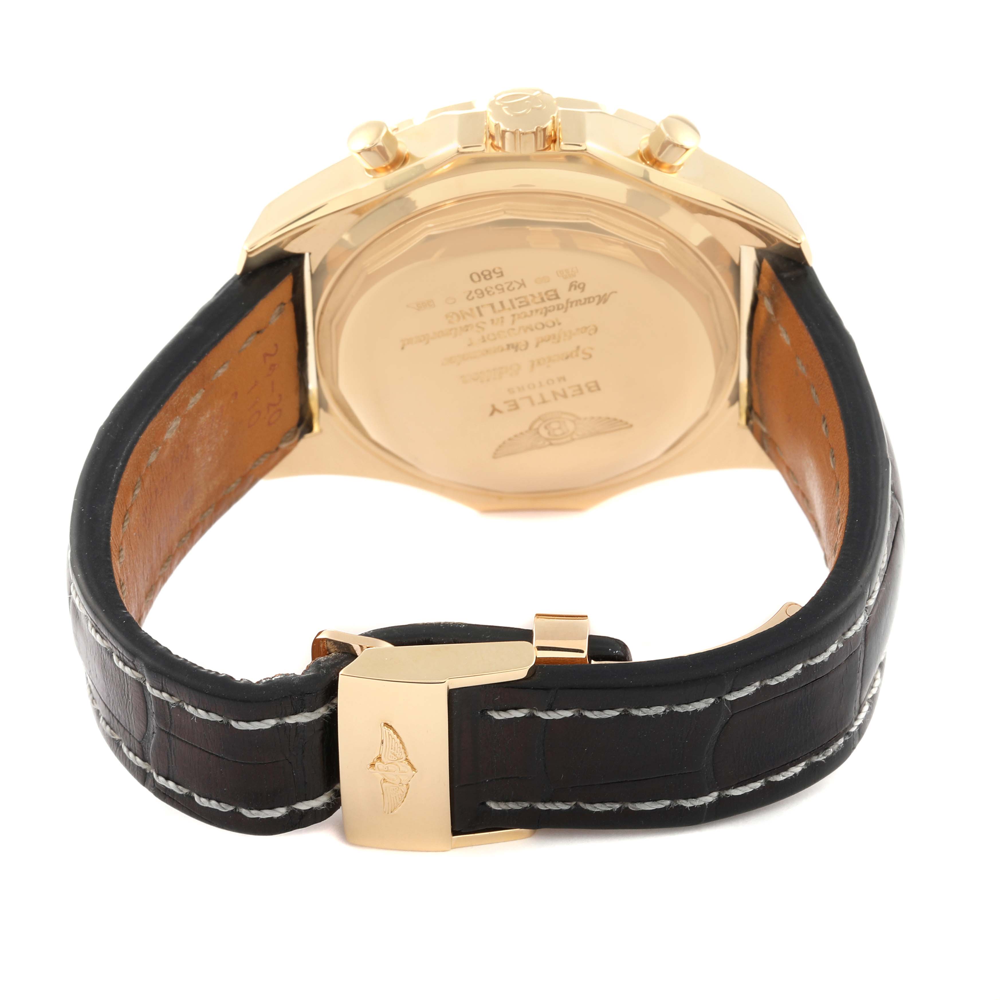 The image shows the back view of a Breitling Bentley K25362 Men's Yellow Gold Black Dial K25362 Men's Yellow Gold Black Dial watch, highlighting the case back and leather strap with a gold clasp.