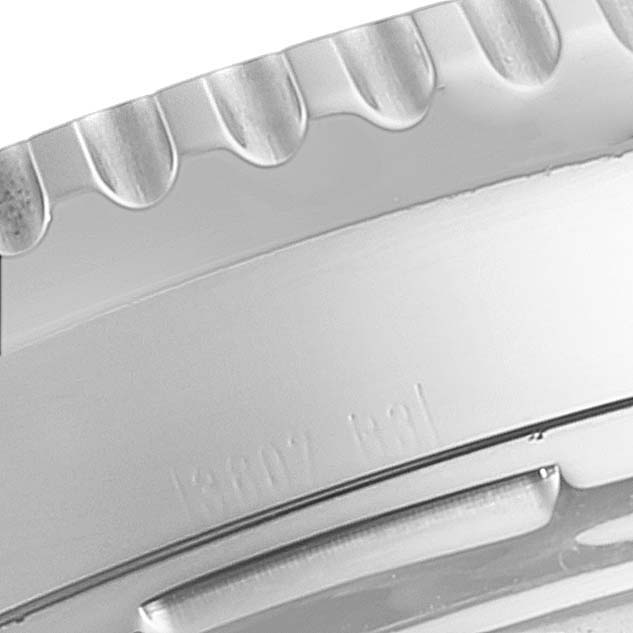 This is a close-up of the bezel edge and part of the case of a Breitling Navitimer A23322 Men's Stainless Steel Black Dial A23322 Men's Stainless Steel Black Dial watch.