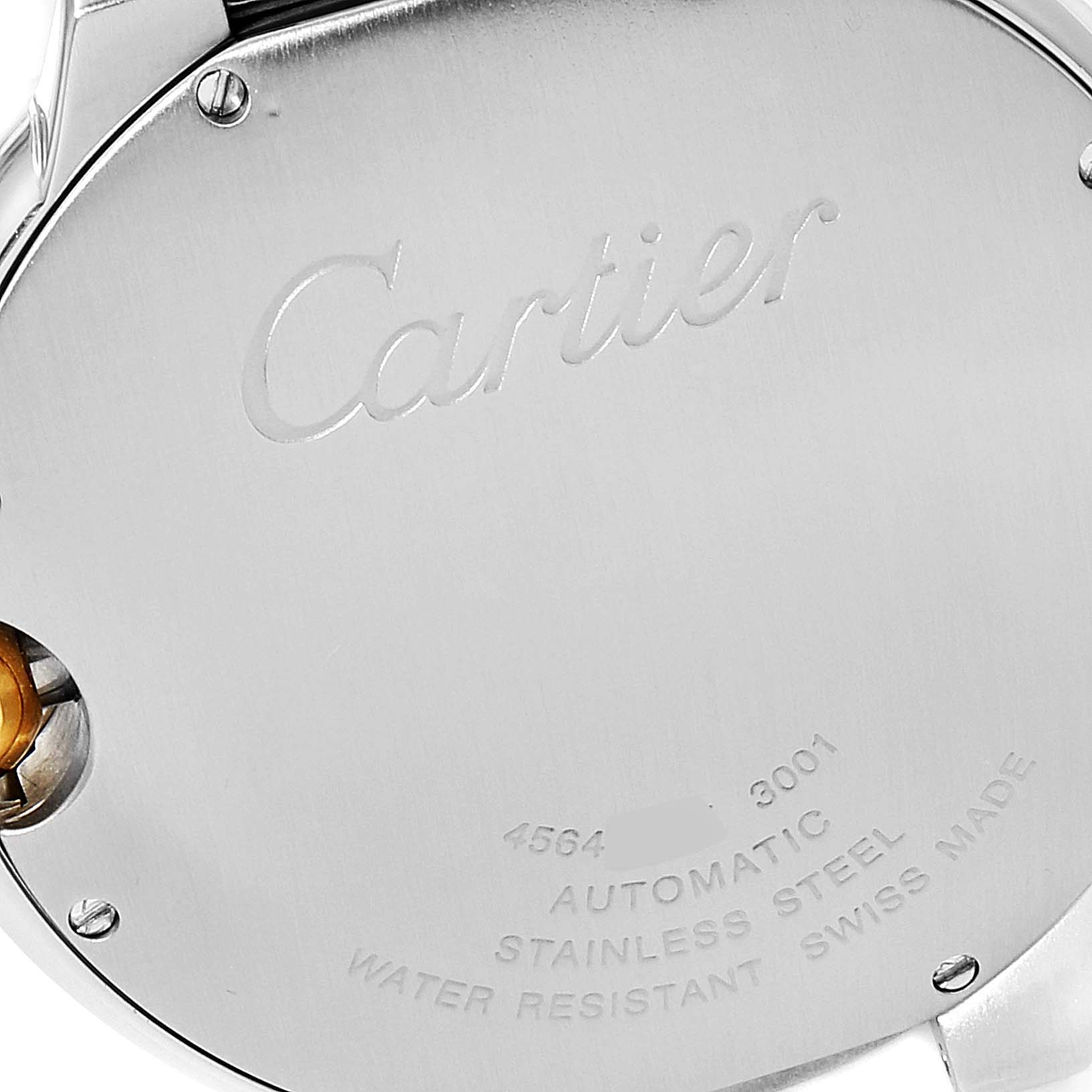 This image shows the back case of a Ballon Bleu model by Cartier, featuring engravings and a partially visible screw.