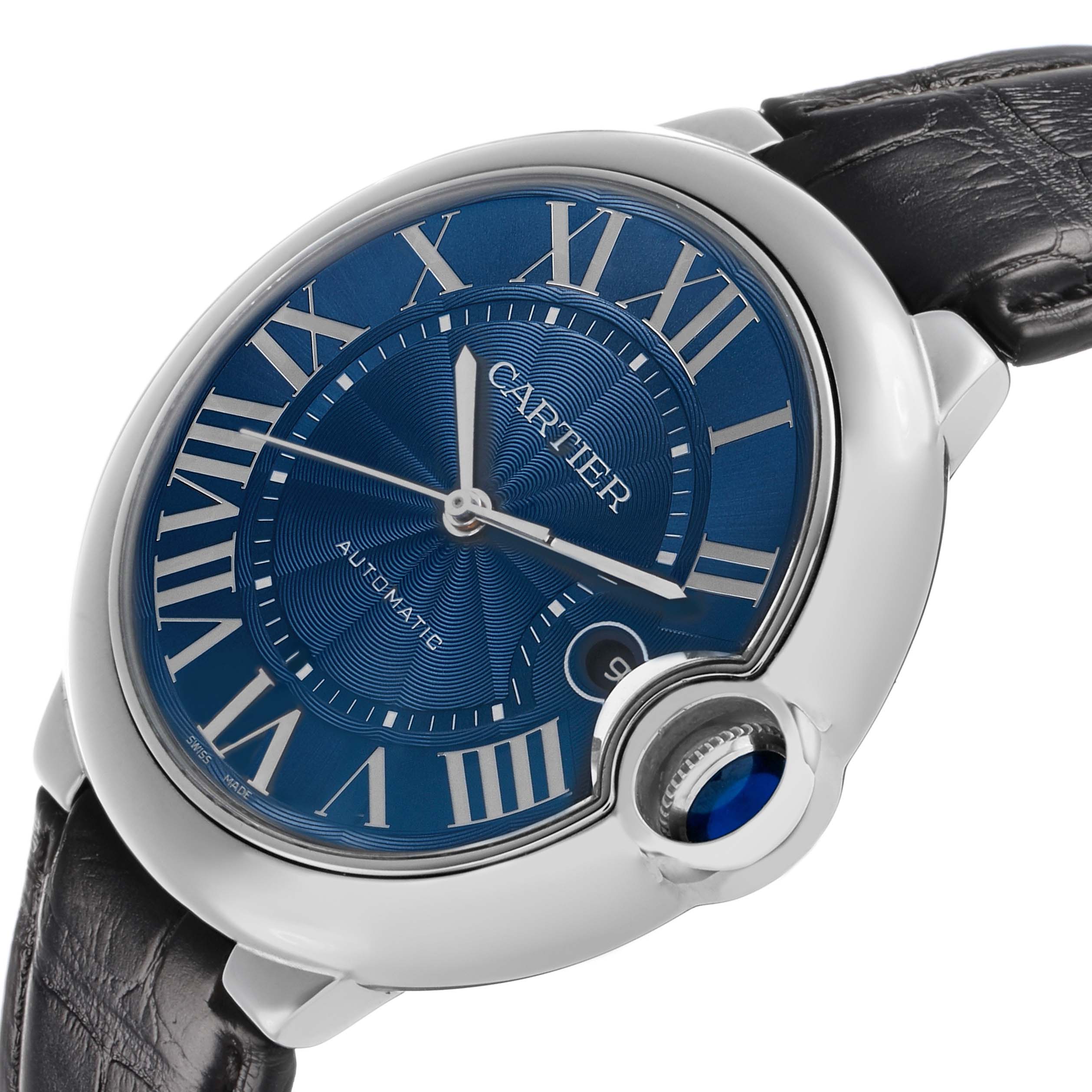 The Cartier Ballon Bleu WSBB0027 Men's Stainless Steel Blue Dial watch is shown at an angled side view, highlighting its blue dial, Roman numerals, and signature crown with a blue cabochon.