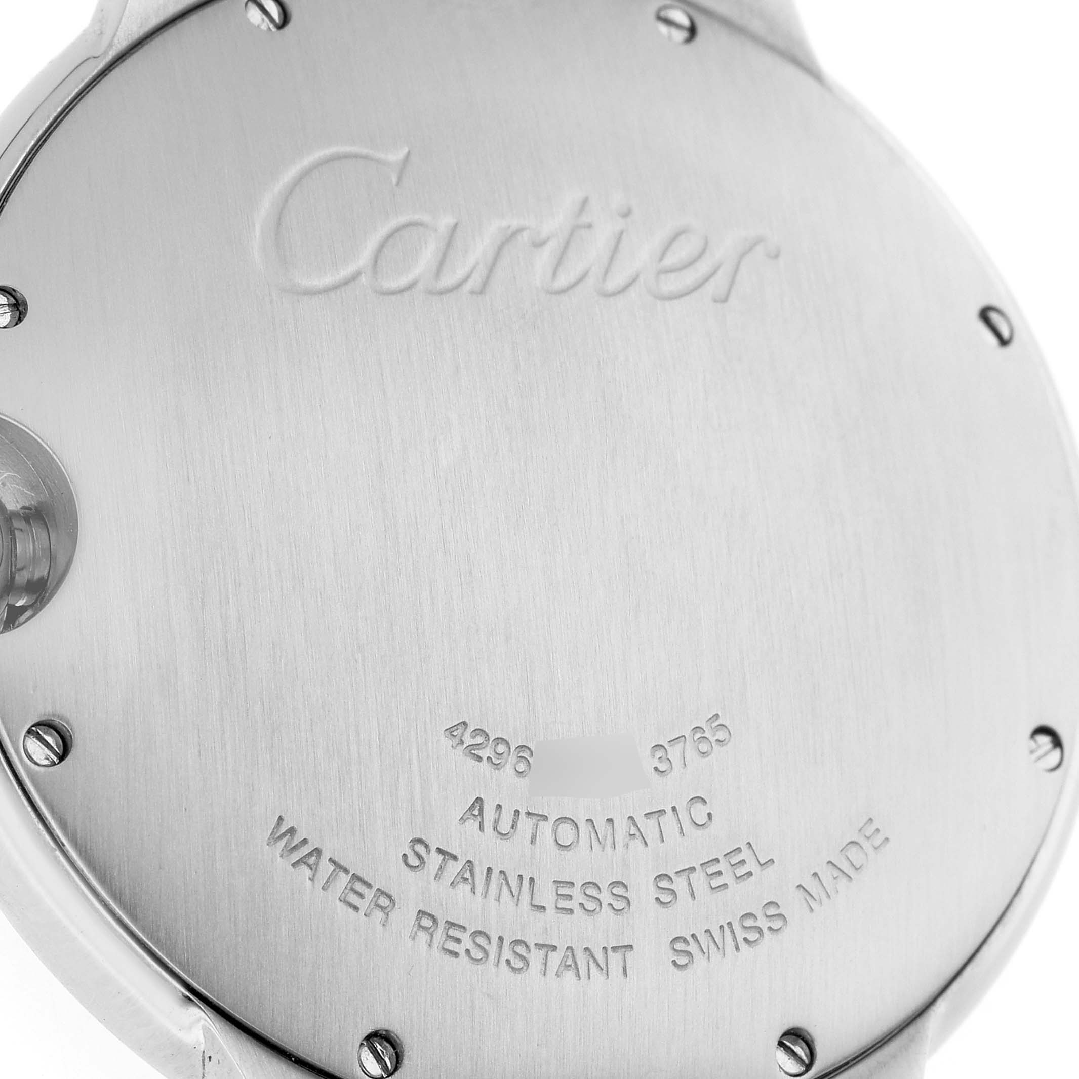 The image shows the back case of a Cartier Ballon Bleu WSBB0027 Men's Stainless Steel Blue Dial watch, displaying engraving details and screws.