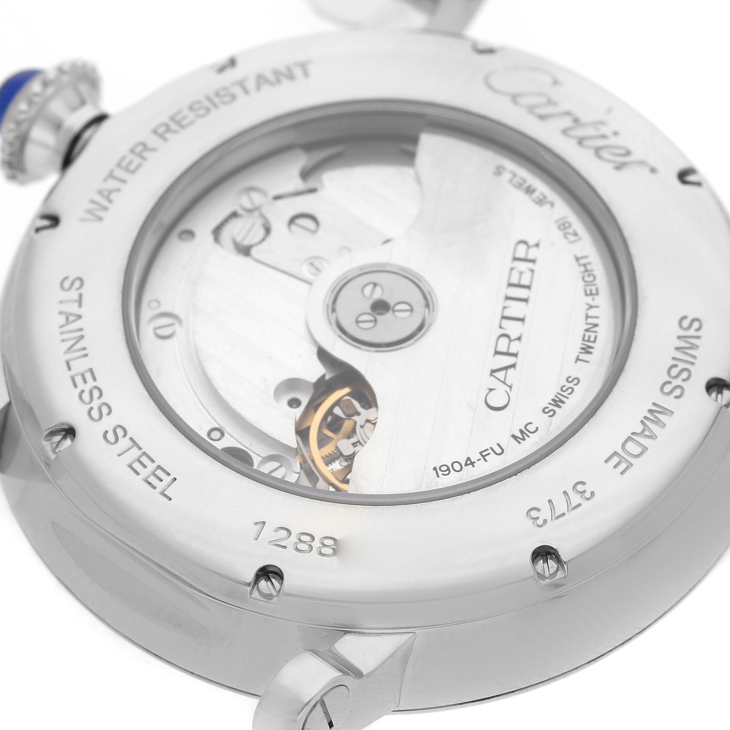 The image shows the back view of a Rotonde de Cartier watch, highlighting its movement and stainless steel casing.