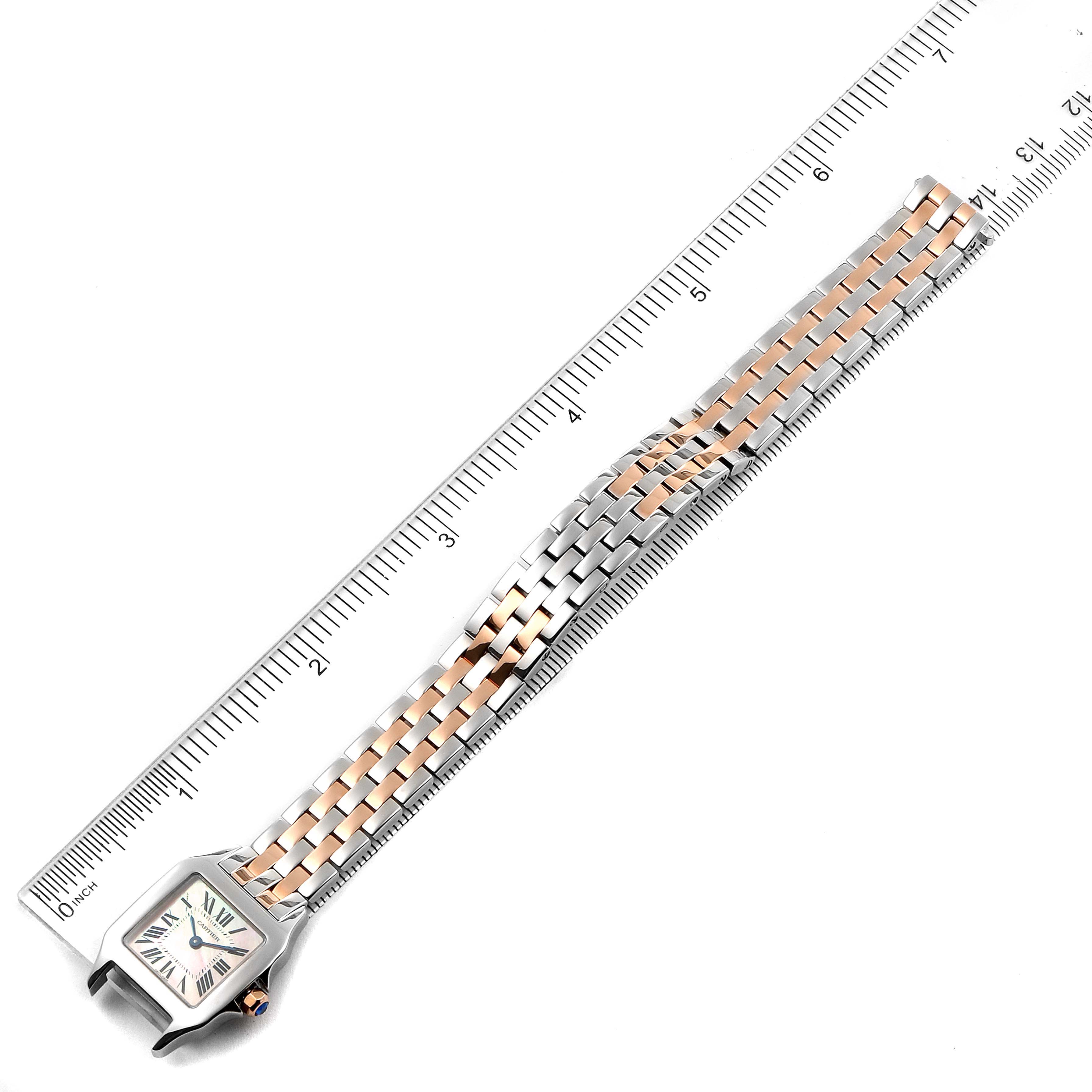 The Cartier Santos Demoiselle W25074Y9 Women's Steel and Gold (two tone) Mother of Pearl Dial W25074Y9 Women's Steel and Gold (two tone) Mother of Pearl Dial watch is shown laid flat with a ruler, displaying the face and the entire metal bracelet.