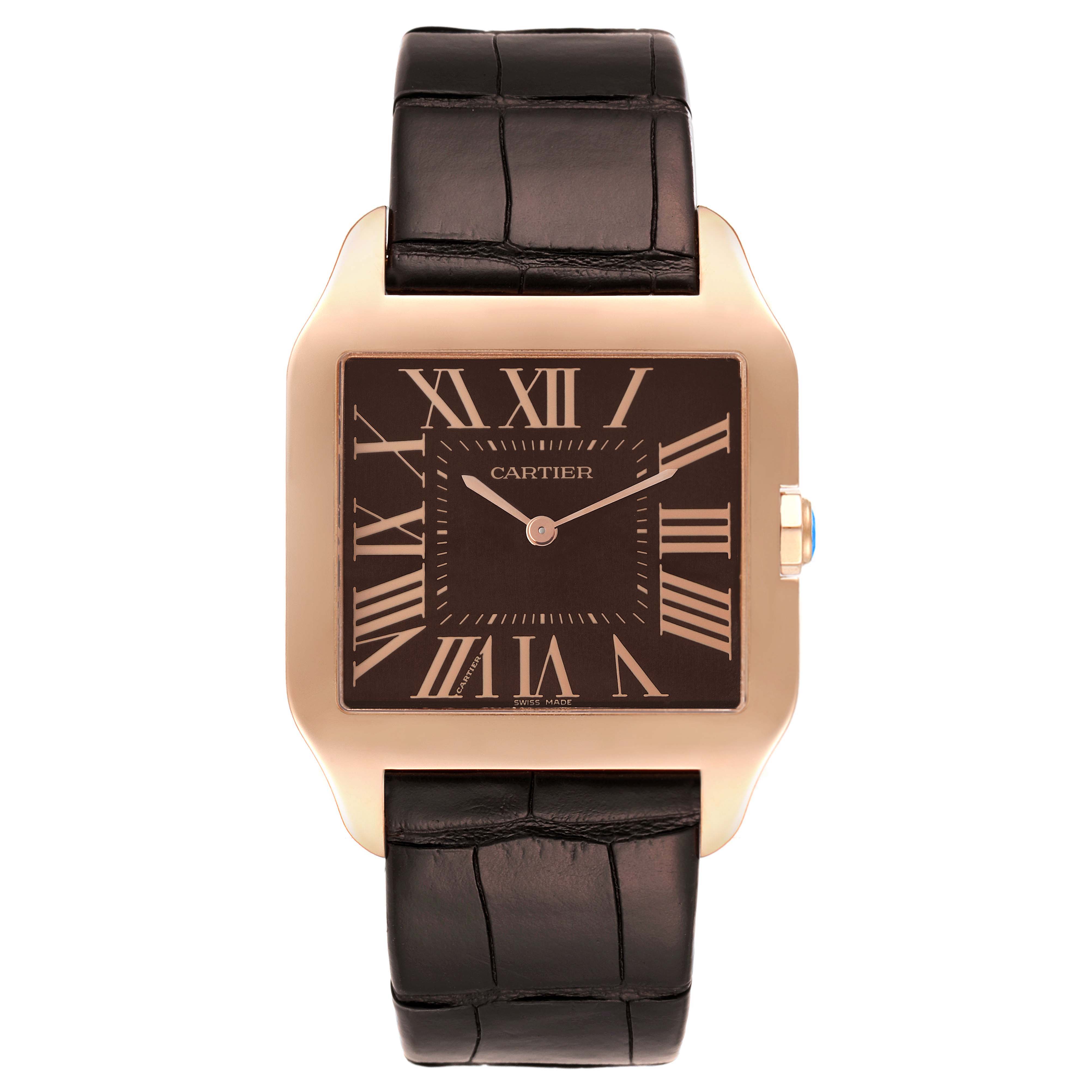 The image shows a frontal view of a Cartier Santos Dumont W2012851 Men's Rose Gold Brown Dial W2012851 Men's Rose Gold Brown Dial watch with a brown leather strap and rectangular face.