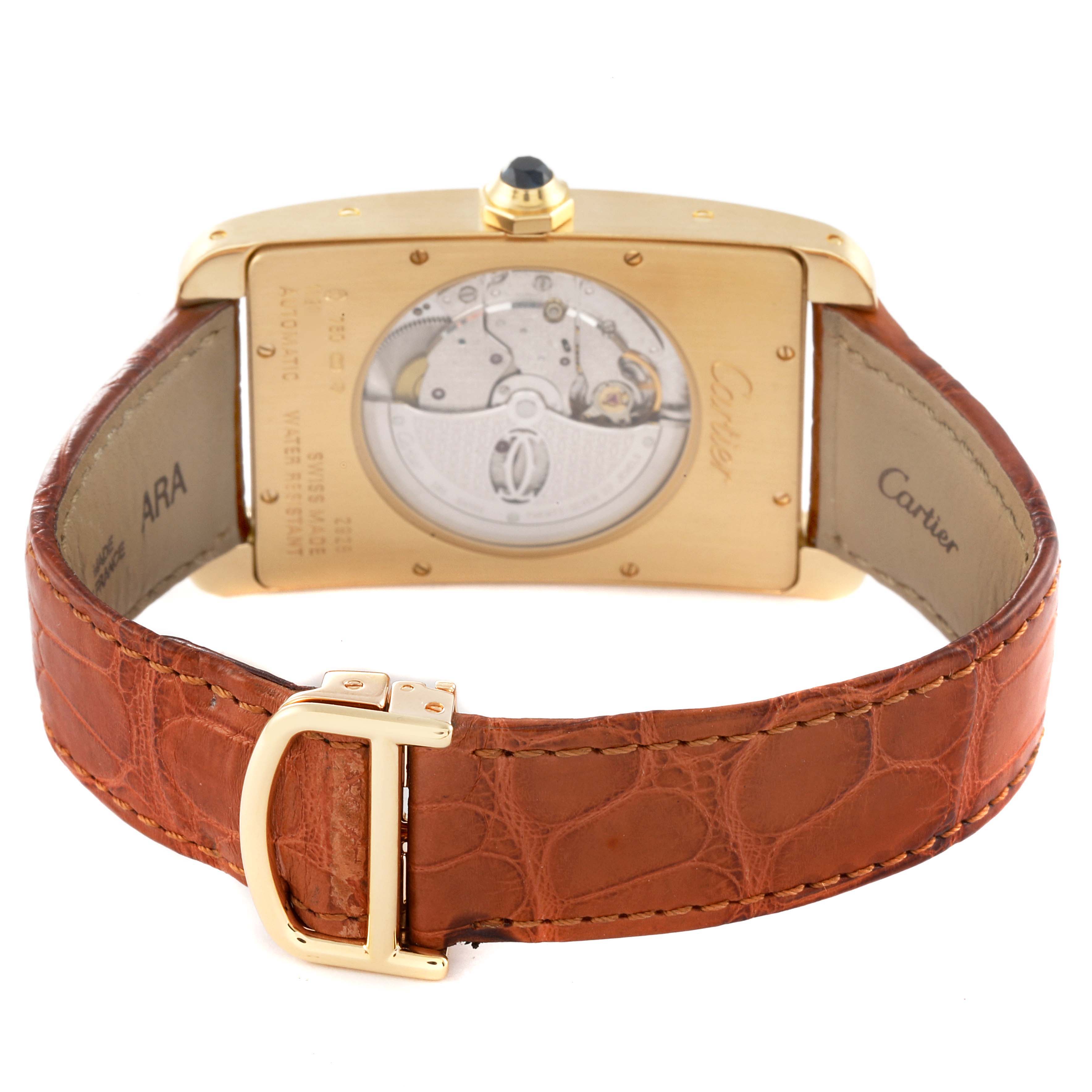 This is a rear view of the Cartier Tank Américaine watch, showing the movement and the leather strap with a gold buckle.