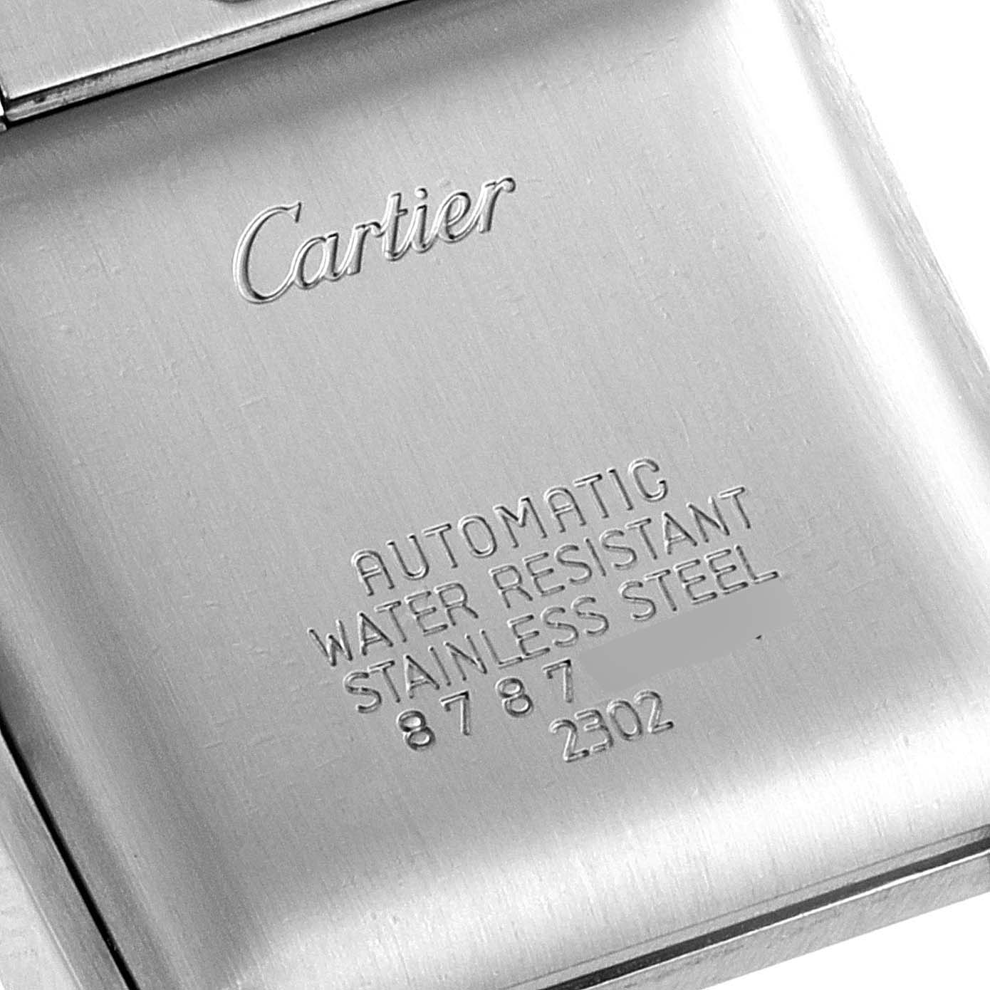 This image shows the back case of a Cartier Tank Francaise W51002Q3 Men's Stainless Steel Silver Dial W51002Q3 Men's Stainless Steel Silver Dial watch with engraved details and brand name.