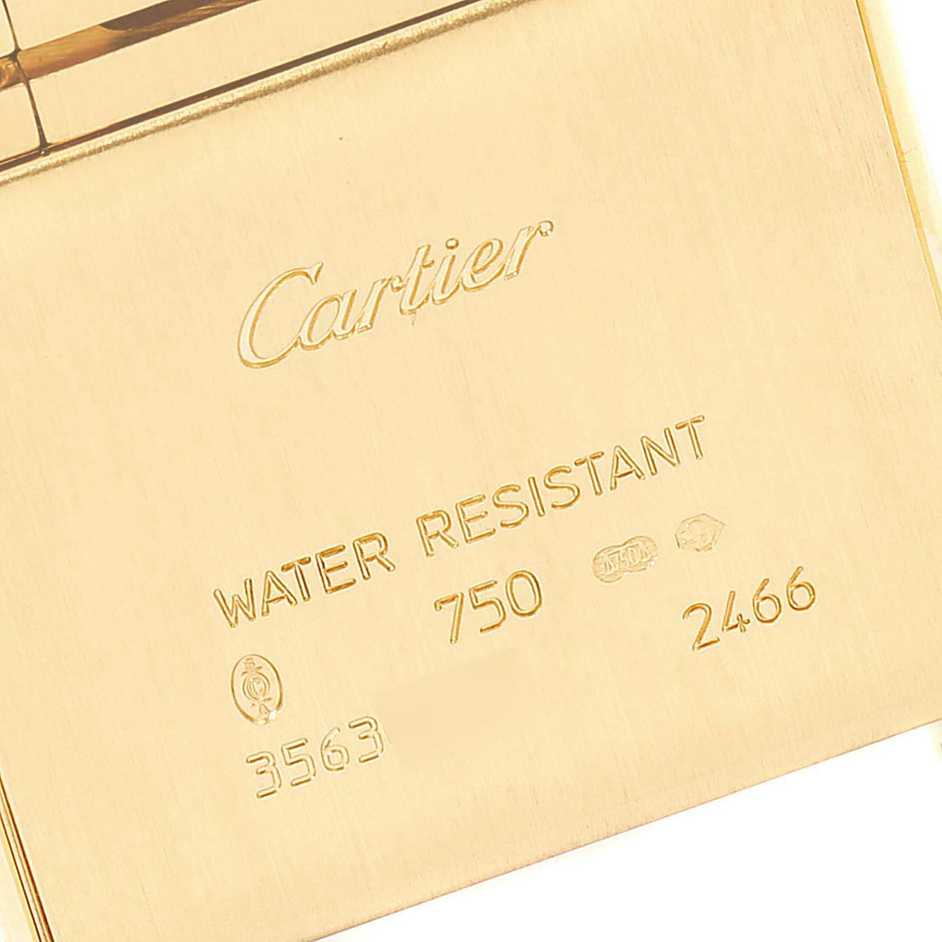 The image shows the back of the Tank Francaise model by Cartier, highlighting engravings and markings.